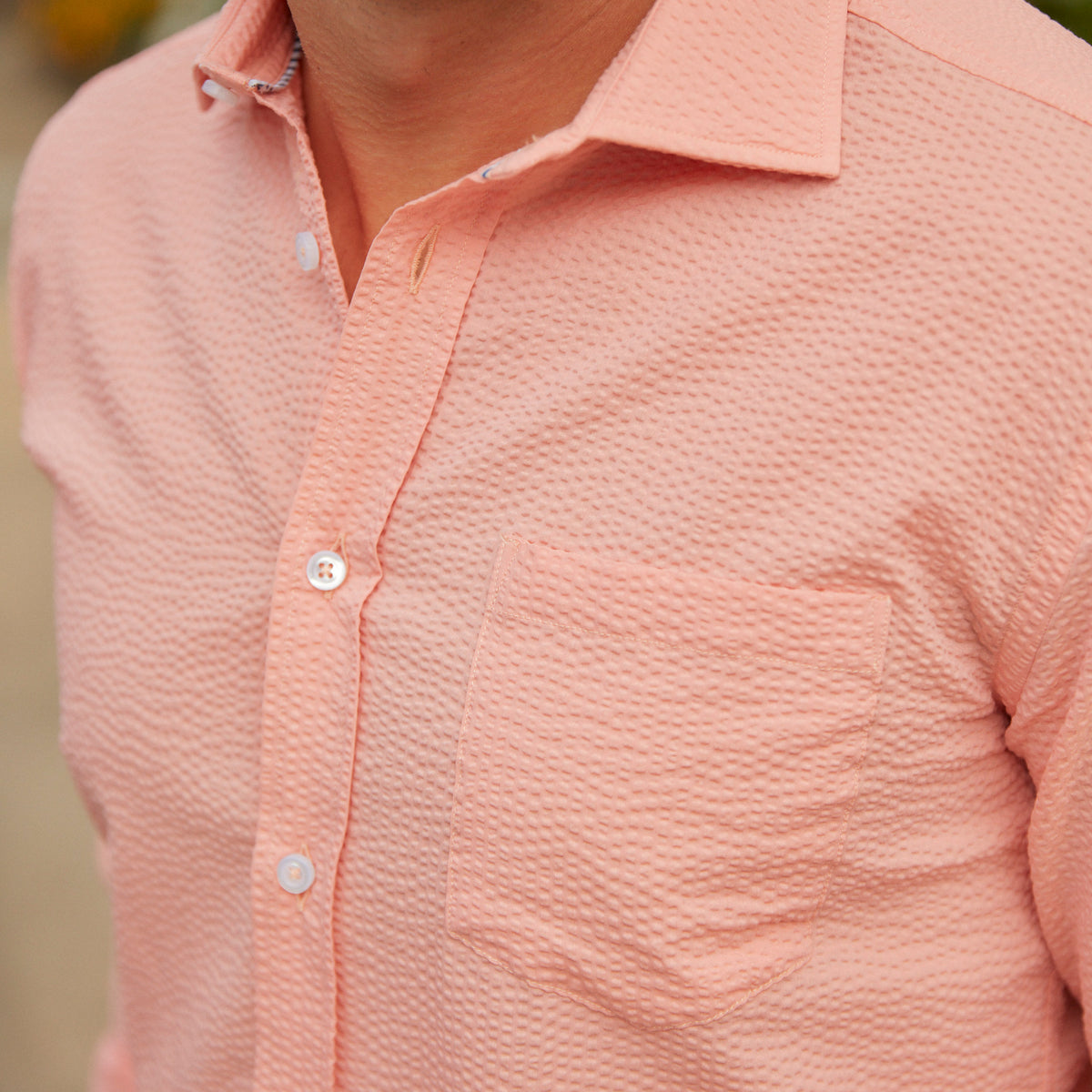 Seersucker all year long in a prefectly peach seersucker shirt. Subtle, lightweight, and a texture they begs a second look.  100% Cotton Seersucker • Spread Collar • Long Sleeve • Chest Pocket • Machine Washable • Made in Italy