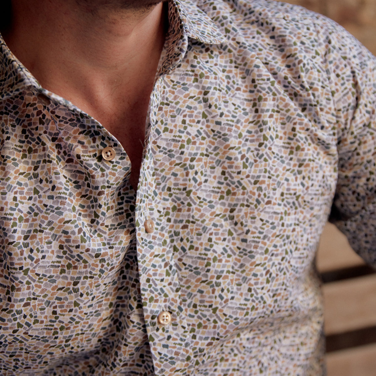 This striking Carroll Olive & Tan Print adds a sophisticated touch to any wardrobe. The olive and tan mosaic print is offset with tan buttons to create an eye-catching look, perfect for a night in New Orleans or wherever your good times take you!  100% Cotton • Spread Collar • Long Sleeve • Machine Washable • Made in Italy • Return Policy