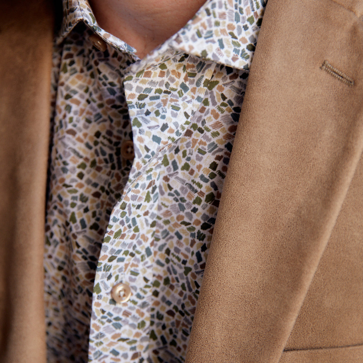 This striking Carroll Olive & Tan Print adds a sophisticated touch to any wardrobe. The olive and tan mosaic print is offset with tan buttons to create an eye-catching look, perfect for a night in New Orleans or wherever your good times take you!  100% Cotton • Spread Collar • Long Sleeve • Machine Washable • Made in Italy • Return Policy