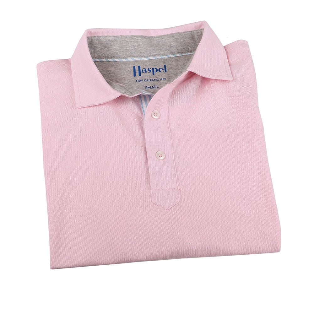 The softest pique polo to ever drape your statuesque torso. Enjoy that future perma-grin as you experience the touch and feel of a shirt that's simple in nature but exudes the quality of a Haspel man.  Our Signature Seersucker Piping and Placket • 3 Button Placket • Open Sleeve • Tagless/Printed Label for Ultimate Comfort • Stretch Comfort • 60% Cotton / 40% Polyester • Machine Washable • Return Policy