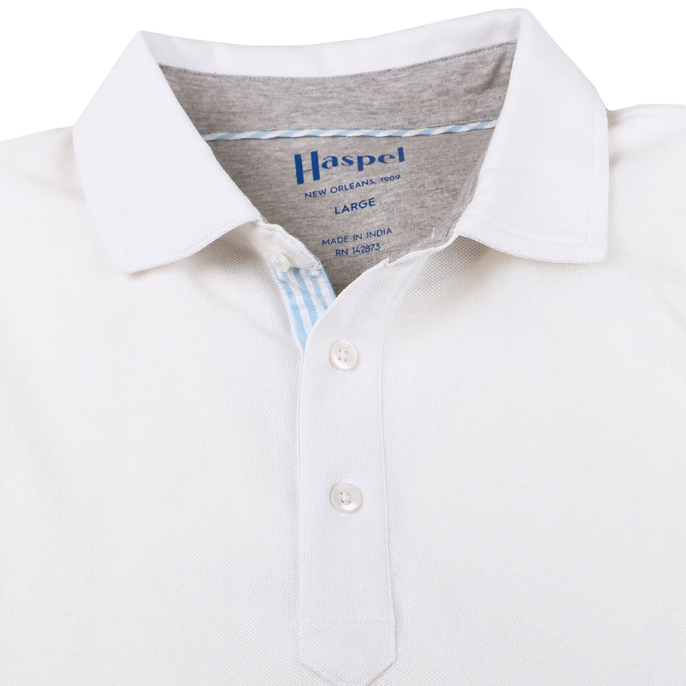 The softest pique polo to ever drape your statuesque torso. Enjoy that future perma-grin as you experience the touch and feel of a shirt that's simple in nature but exudes the quality of a Haspel man. Our Signature Seersucker Piping and Placket • 3 Button Placket • Open Sleeve • Tagless/Printed Label for Ultimate Comfort • Stretch Comfort • 60% Cotton / 40% Polyester • Machine Washable • Return Policy