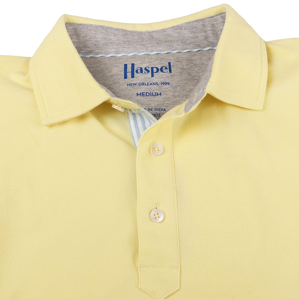The softest pique polo to ever drape your statuesque torso. Enjoy that future perma-grin as you experience the touch and feel of a shirt that's simple in nature but exudes the quality of a Haspel man.  Our Signature Seersucker Piping and Placket • 3 Button Placket • Open Sleeve • Tagless/Printed Label for Ultimate Comfort • Stretch Comfort • 60% Cotton / 40% Polyester • Machine Washable • Return Policy