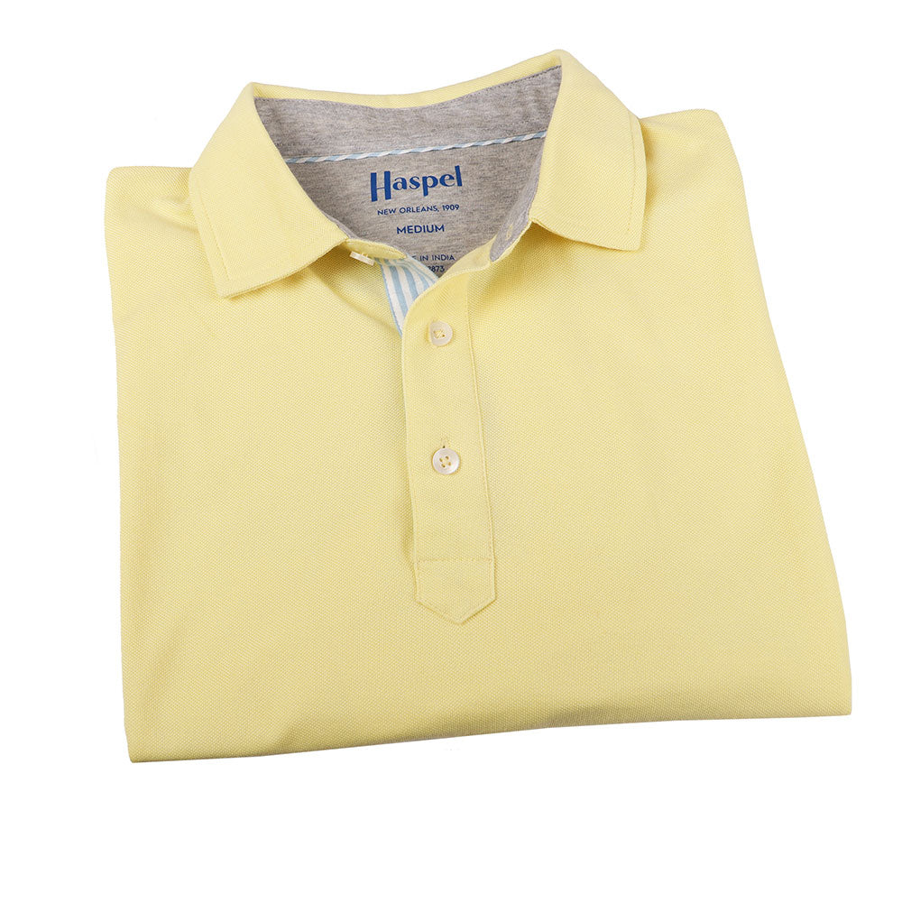 The softest pique polo to ever drape your statuesque torso. Enjoy that future perma-grin as you experience the touch and feel of a shirt that's simple in nature but exudes the quality of a Haspel man.  Our Signature Seersucker Piping and Placket • 3 Button Placket • Open Sleeve • Tagless/Printed Label for Ultimate Comfort • Stretch Comfort • 60% Cotton / 40% Polyester • Machine Washable • Return Policy