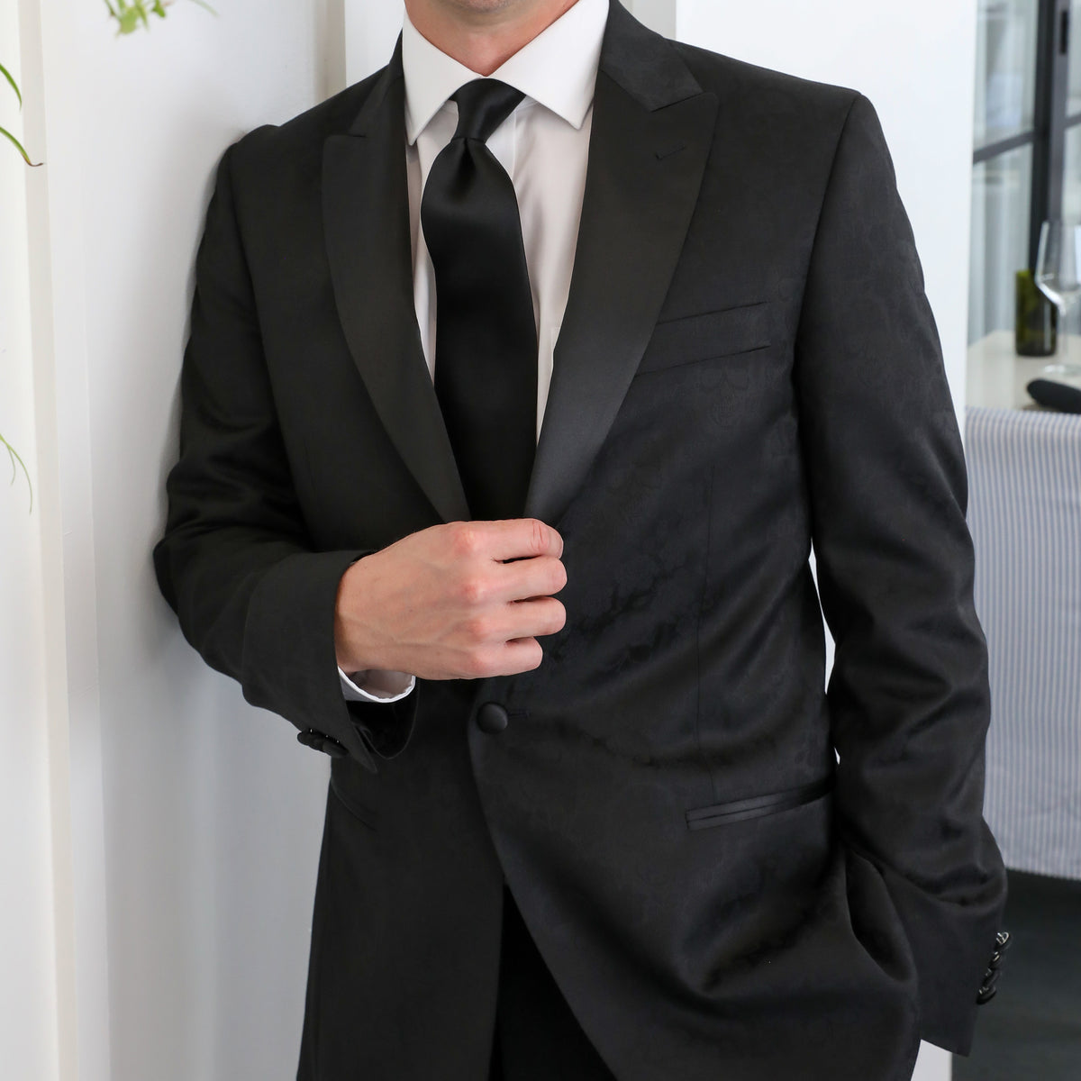 This dinner jacket will be the talk of the party!  Bold yet subtle, our skull print black dinner jacket can be dressed up and worn formal, or wear it casual to make your presence known.  60% Polyester / 20% Wool / 20% Viscose • Toulouse Tailored Fit • Natural Shoulder • One Button Closure • Besom Pockets • Fully Lined • 2 Side Vents • Satin Peak Lapel • Dry Clean Only • Return Policy