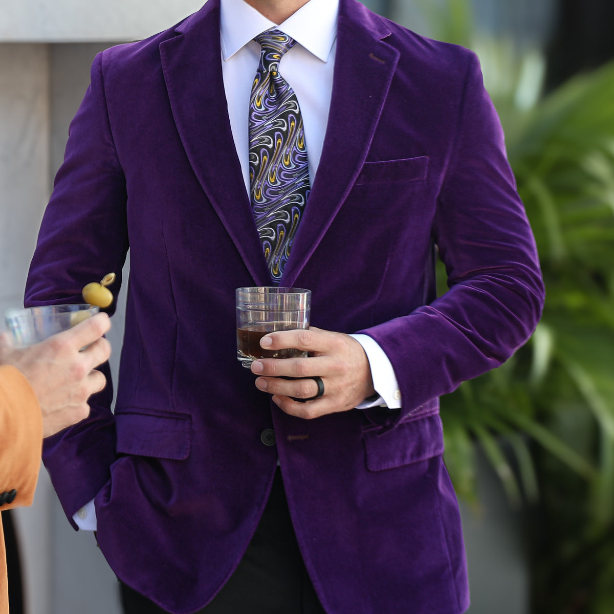 Make a statement at your next dinner party in this purple Audubon jacket! A fun and smooth velvet material will make you feel cool and comfortable, while you show up your friends!  100% cotton • Audubon Classic Fit • Natural Shoulder • Two Button Closure• Flap Pockets • 3/4 Lined • 2 Side Vents • Satin Notch Lapel • Dry Clean Only