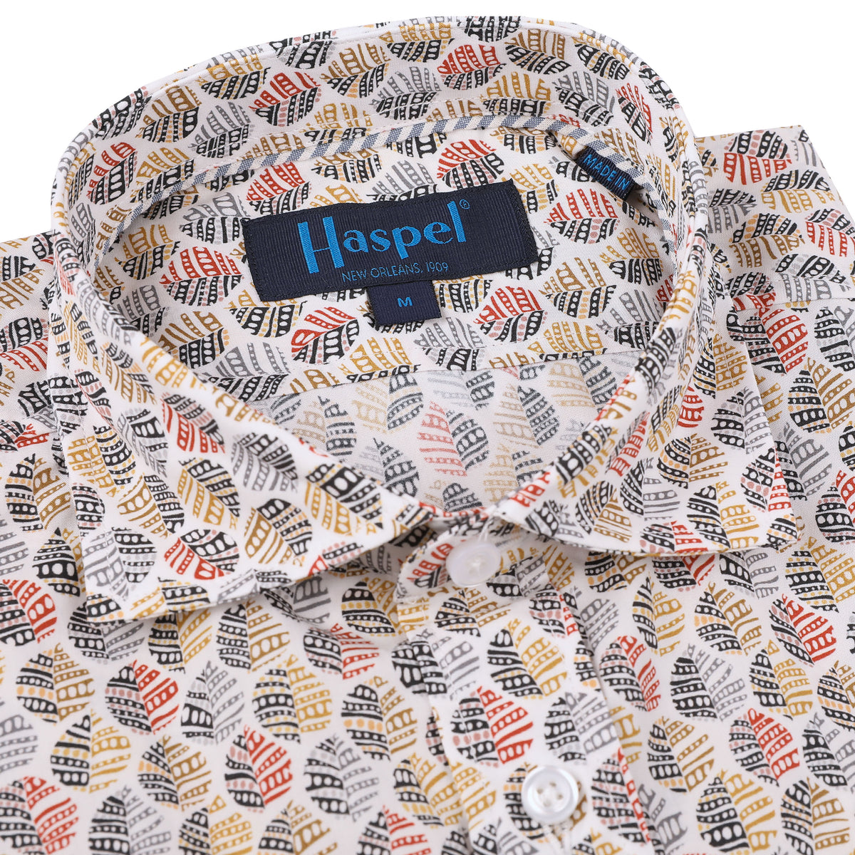 The Carroll Red & BlackPrint Shirt features a daring leaf pattern in vivid reds, blacks, and tans. Featuring striking white buttons, this sport shirt will take you from the office to the outdoors with a fearless look.  100% Cotton • Spread Collar • Long Sleeve • Machine Washable • Made in Italy • Return Policy