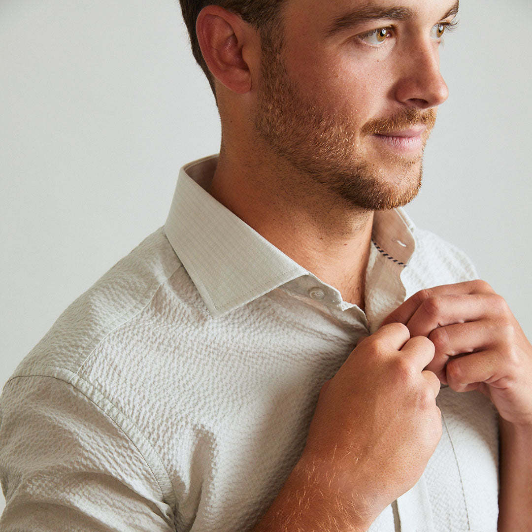A solid look for a solid guy. The classic look of light grey on a short sleeve seersucker beauty. Seersucker, lightweight, and supremely cool. Available in short or long sleeve.  100% Cotton Seersucker  •  Spread Collar  •  Short Sleeve  •  Chest Pocket  •  Machine Washable  •  Made in Italy