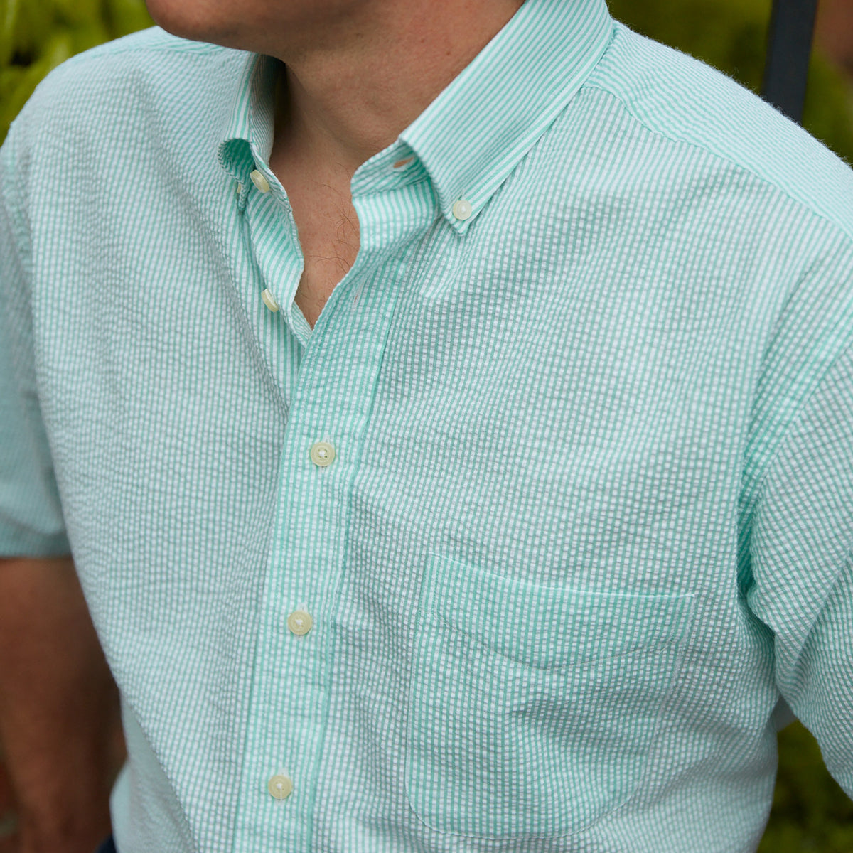 Seersucker all year long in a minty green seersucker shirt. Subtle, lightweight, and a texture they begs a second look.  100% Cotton Seersucker • Button Down Collar • Short Sleeve • Chest Pocket • Machine Washable • Made in Italy