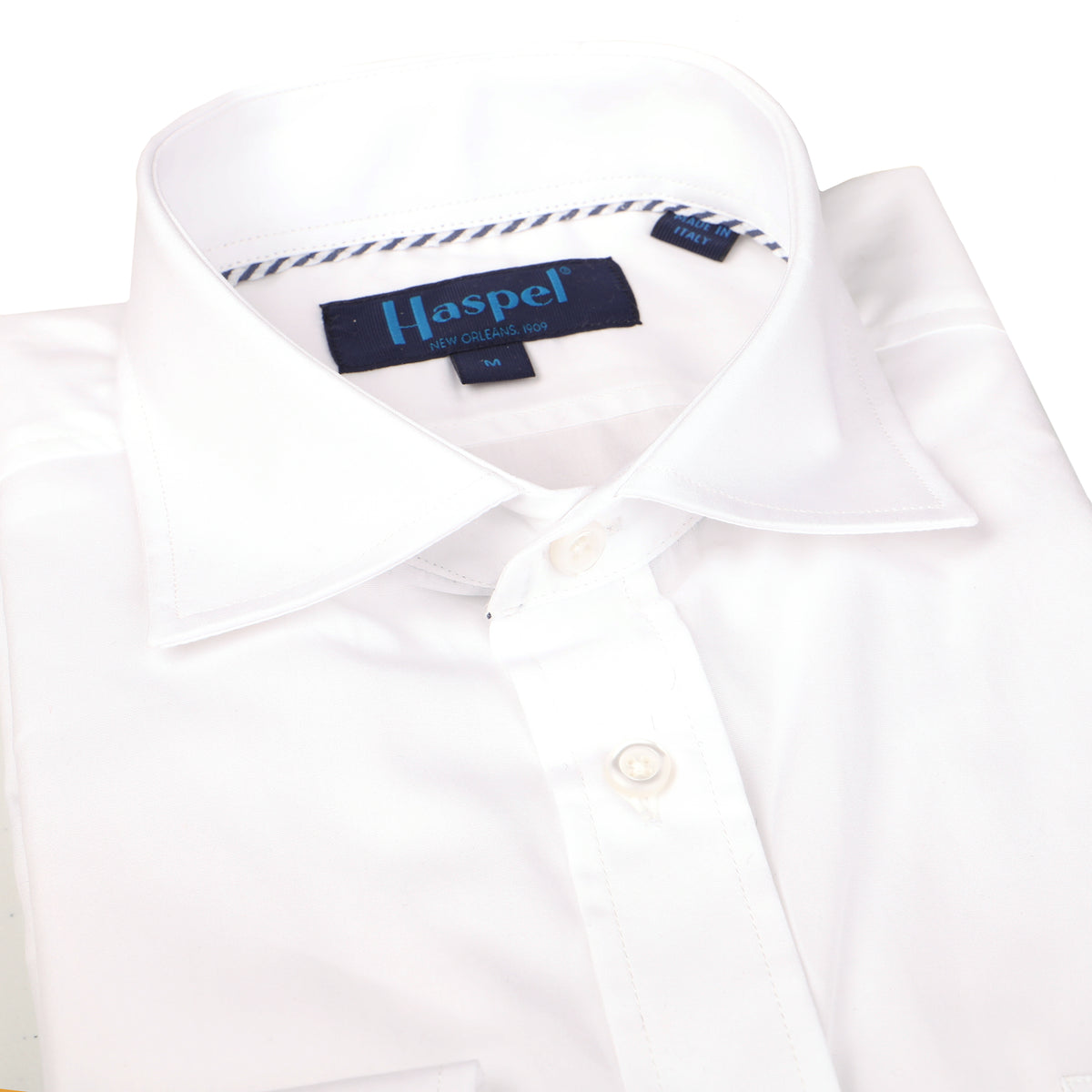 Keep poppin&#39; in poplin. Solid white, solid look. Nothing better than a new crisp white shirt.  100% Cotton  •  Long Sleeve  •  Spread Collar  •  Chest Pocket  •  Button Cuff  •  Machine Washable  •  Made in Italy Return Policy