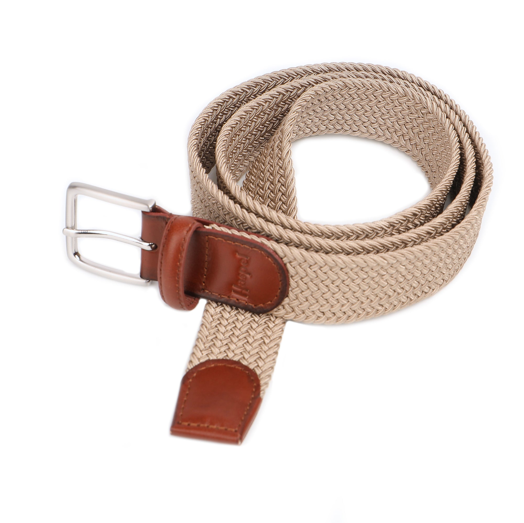 Our braided belts are woven to add a rich style to any look. Featuring leather end tabs, a solid nickel buckle with antique finish, and color choices in both solid and mult-colored of braided elastic.  Alpha Sizing • Braided elastic • Leather End Tabs • 1-1/4" Wide • Solid Nickel Buckle, Antique Finish • Imported 
