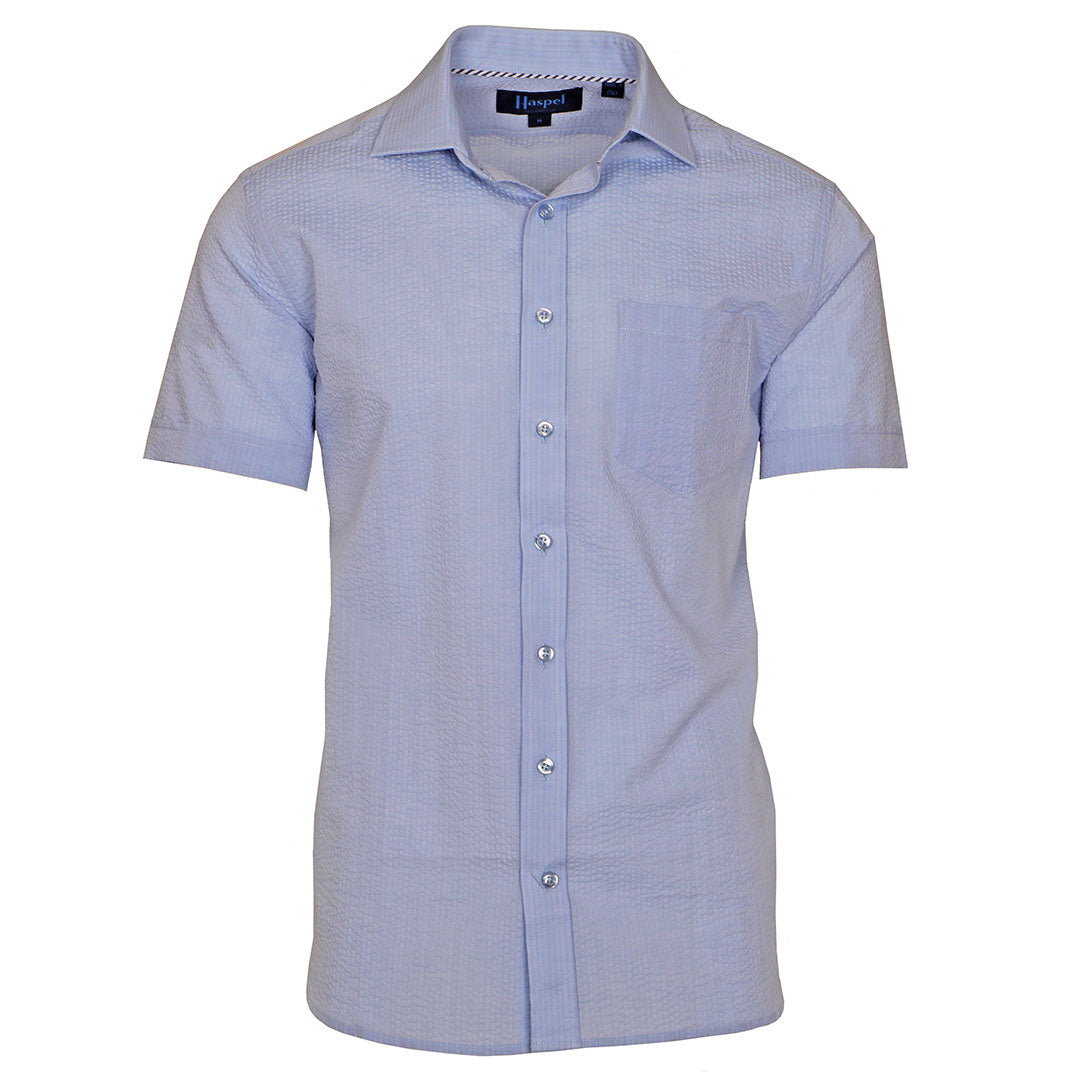 A solid look for a solid guy. The most beautiful light blue short sleeve shirt soon to be on your statuesque frame. Seersucker, lightweight, and supremely cool. Available in short or long sleeve.  100% Cotton Seersucker  •  Spread Collar  •  Short Sleeve  •  Contrast Buttons  •  Chest Pocket  •  Machine Washable  •  Made in Italy