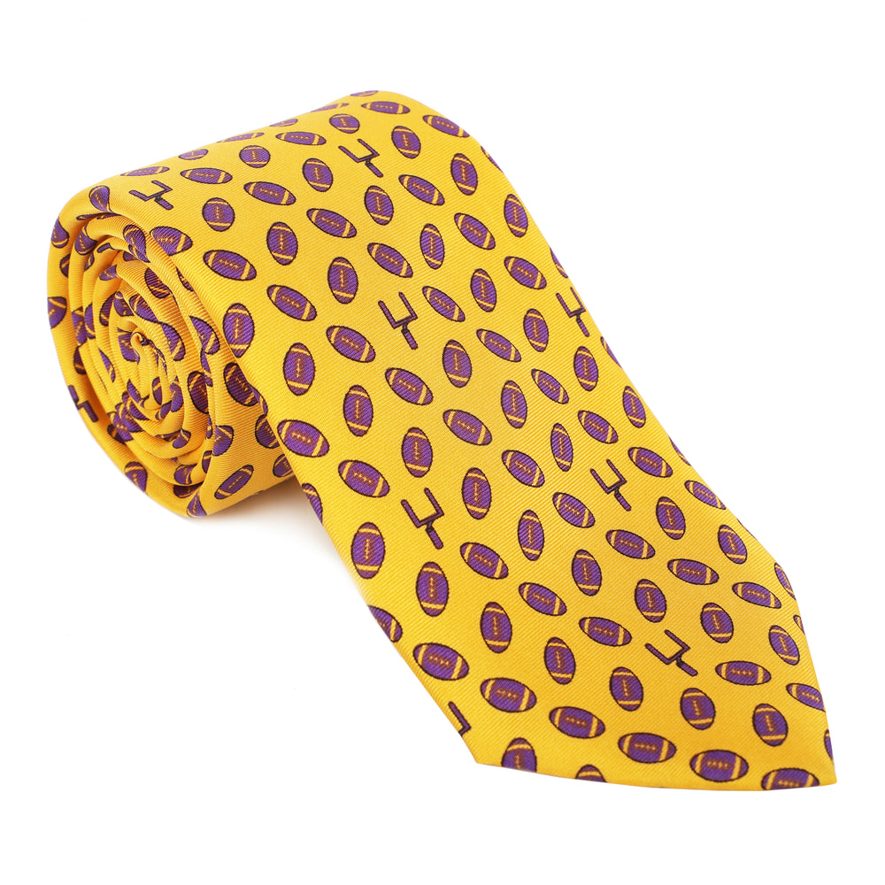 Represent like royalty in our regal 100% silk ties. Purple & gold and good to geaux (go)! Tie one on so you can tie one on! Limited Edition Haspel x NOLA Couture Exclusive Collaboration • 100% Silk • 3" Wide • Seersucker Tipped and Seersucker Keeper • Made in USA