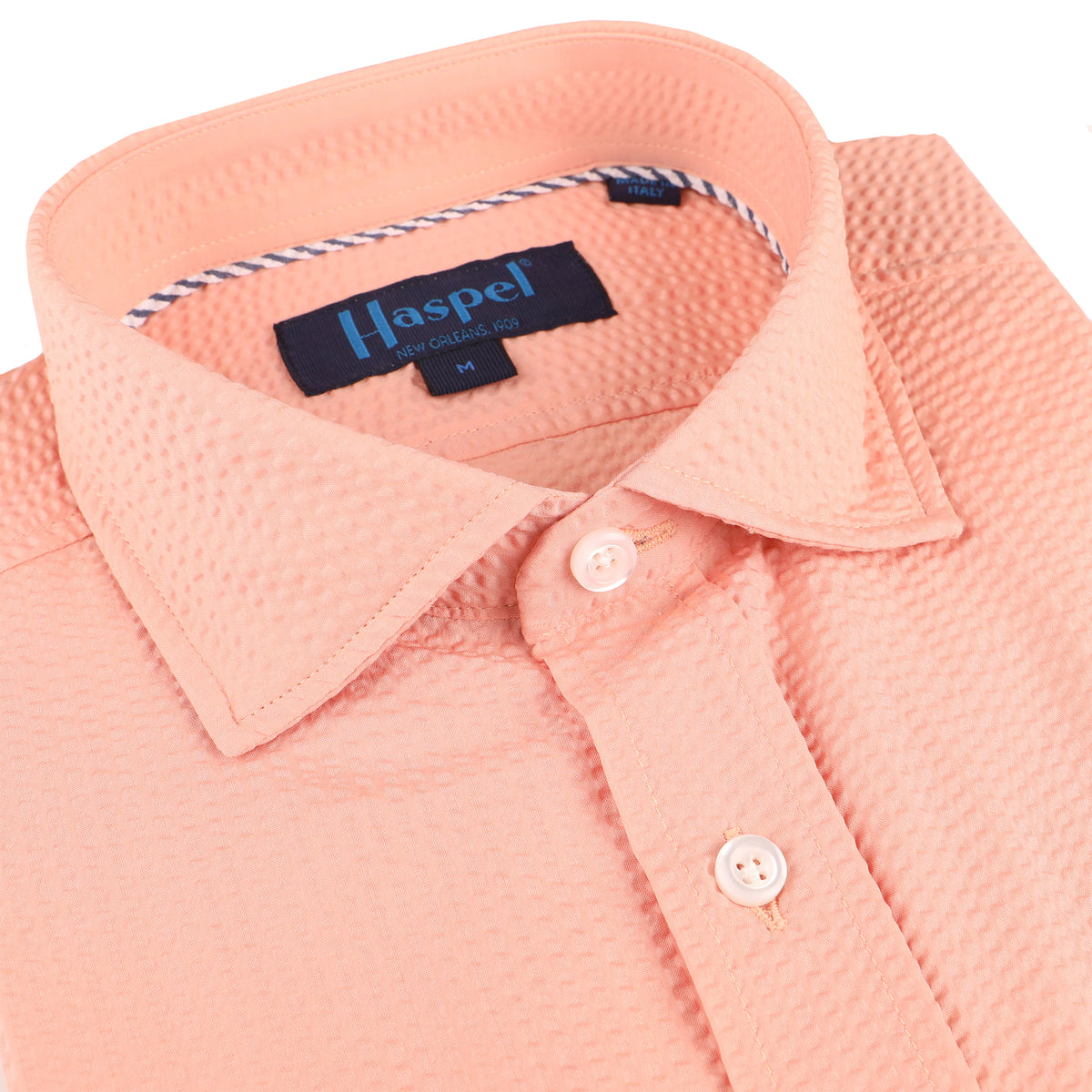 Seersucker all year long in a prefectly peach seersucker shirt. Subtle, lightweight, and a texture they begs a second look.  100% Cotton Seersucker • Spread Collar • Long Sleeve • Chest Pocket • Machine Washable • Made in Italy