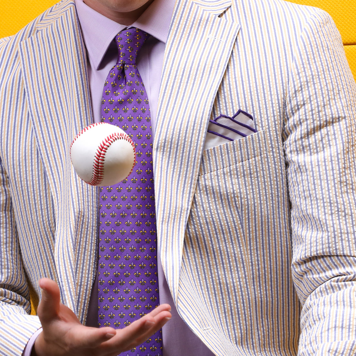 Show your purple &amp; gold spirit in our Embassy Purple &amp; Gold Seersucker Suit.  ** Pant waist is 6&quot; smaller than the chest measurement. For example, if you order a 40R jacket, the pant size will be 34 **  100% Cotton Haspel Exclusive Seersucker • Maximized Seersucker Pucker • Audubon Classic Fit • Natural Shoulder • Two Buttons • Flap Pockets • 3/4 Lined for Maximum Cool • Side Vents • Notch Lapel • Dry Clean • Imported