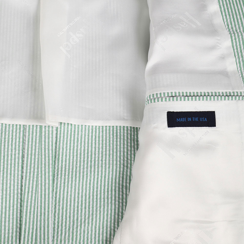 The chill of a pewter cup, the finish of a fine Kentucky bourbon, & the crunch of that good ice - get that Derby Day feeling in our refreshingly minty stretch seersucker.   97% Cotton / 3% Lycra Haspel Exclusive Seersucker Stretch Fabric • Maximized Seersucker Pucker • Audubon Classic Fit • Natural Shoulder • Two Buttons • Flap Pockets • 3/4 Lined for Maximum Cool • Side Vents • Notch Lapel • Dry Clean • Made in USA
