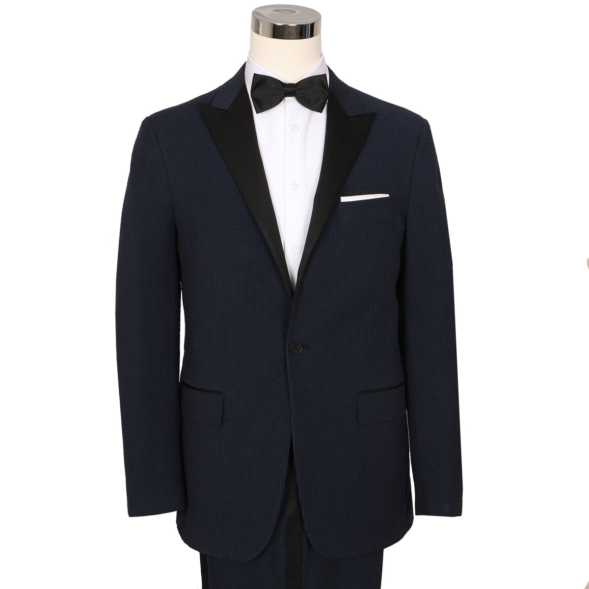 Stand out in a room full of penguins with this navy/black masterpiece. Bond ain&#39;t got nothing on you in this seersucker tux. Nail those new moves with stretch.  ** Pant waist is 6&quot; smaller than the chest measurement. For example, if you order a 40R jacket, the pant size will be 34 **
