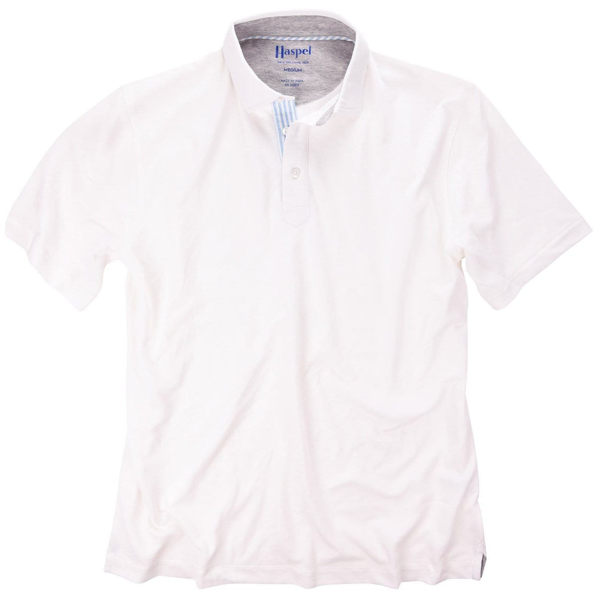 The softest pique polo to ever drape your statuesque torso. Enjoy that future perma-grin as you experience the touch and feel of a shirt that's simple in nature but exudes the quality of a Haspel man.  Our Signature Seersucker Piping and Placket • 3 Button Placket • Open Sleeve • Tagless/Printed Label for Ultimate Comfort • Stretch Comfort • 60% Cotton / 40% Polyester • Machine Washable • Return Policy