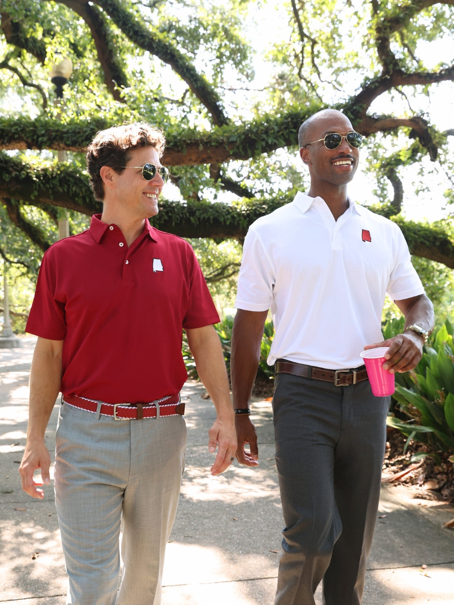 Crafted to add a rich style to any look, our elastic belts feature a leather tab, antique nickel finish buckle, and color choices to support our favorite collegiate teams.   Braided elastic • Briar Waxy Leather Points • 1-3/8" wide • Antique Nickel Finish Buckle • Imported • Always order belts one size above your natural waist size. • Return Policy