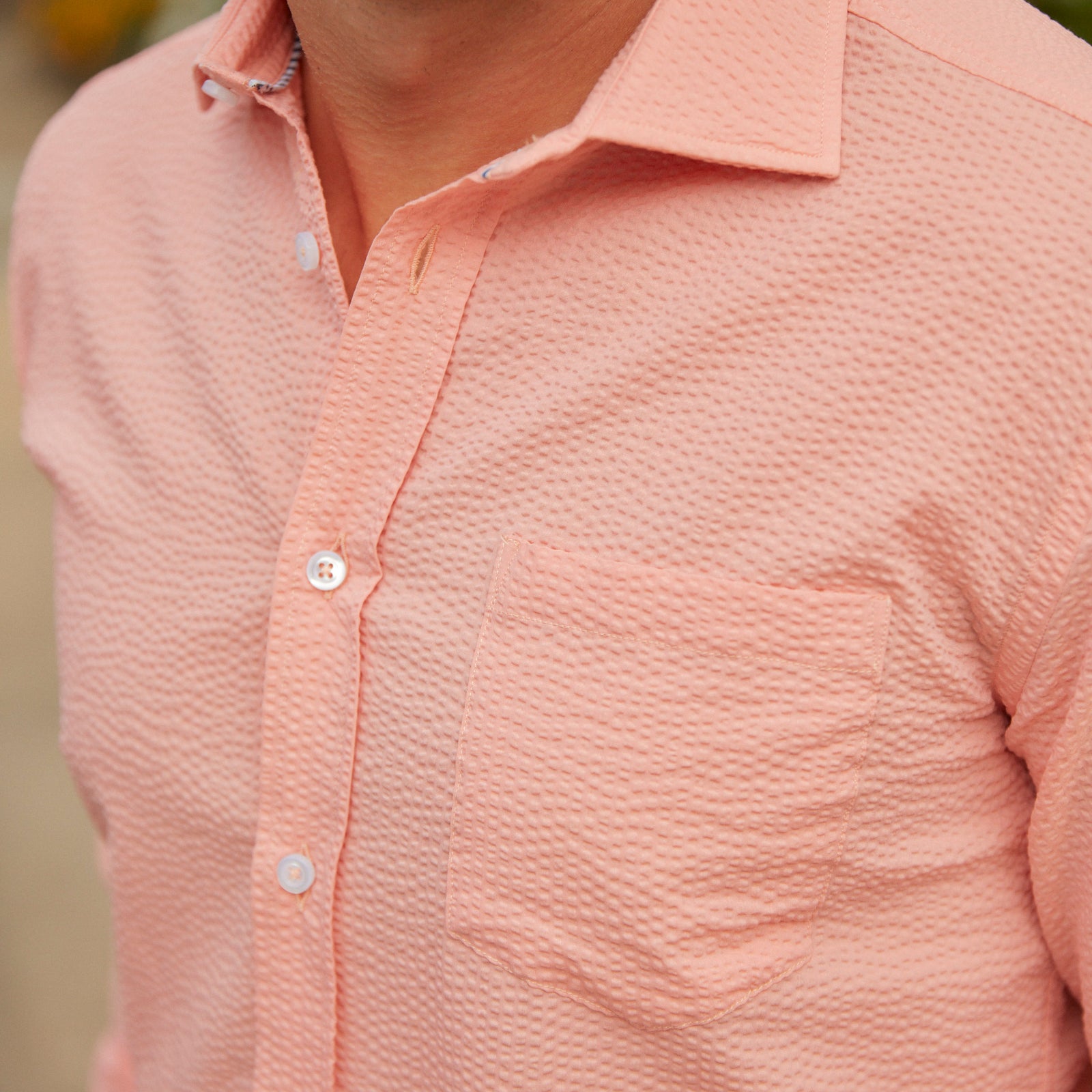 Seersucker all year long in a prefectly peach seersucker shirt. Subtle, lightweight, and a texture they begs a second look.  100% Cotton Seersucker • Spread Collar • Long Sleeve • Chest Pocket • Machine Washable • Made in Italy