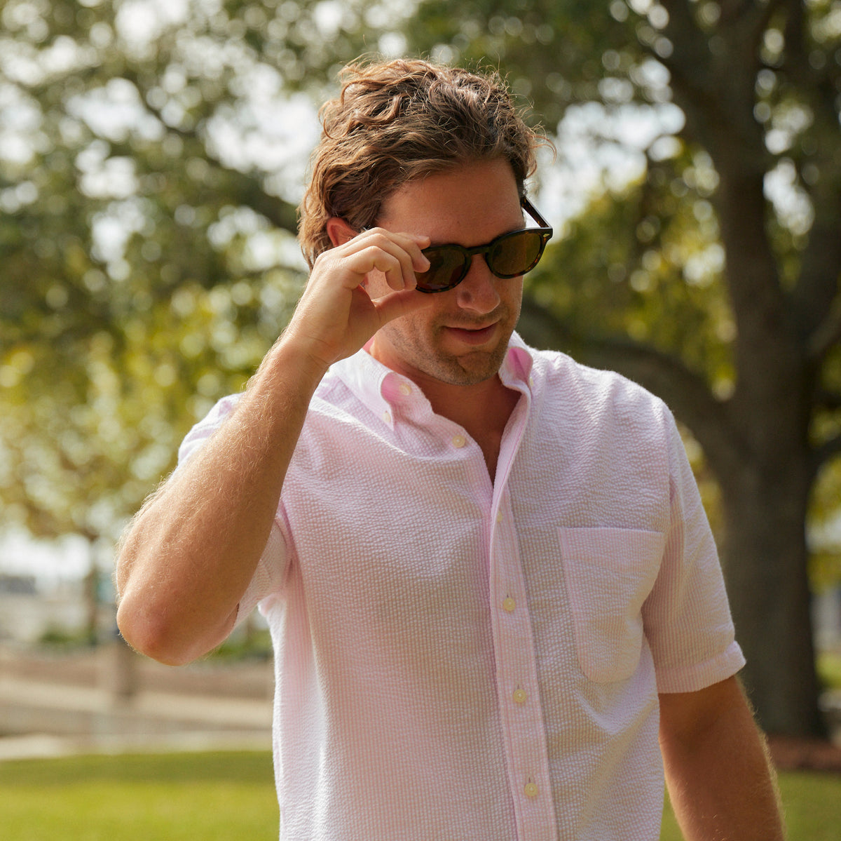 Seersucker all year long in a soft pink seersucker shirt. Subtle, lightweight, and a texture they begs a second look.  100% Cotton Seersucker • Button Down Collar • Short Sleeve • Chest Pocket • Machine Washable • Imported