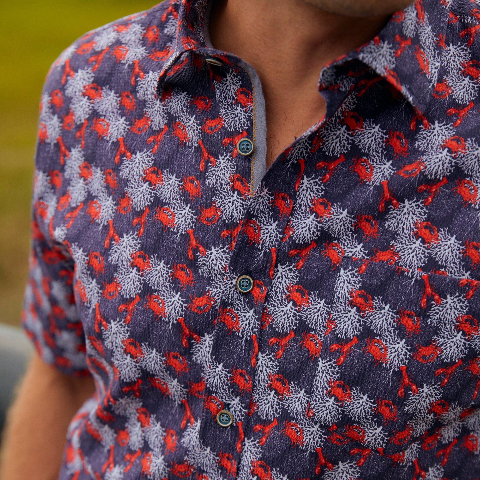 Make a fashion statement at all your crustacean inspired good times. That classic seersucker pucker will keep you cool while your shindig heats up. Prepare to be noticed with this bold and striking style.  100% Cotton Seersucker • Short Sleeve • Spread Collar • No Chest Pocket • Machine Wash • Made in Italy 