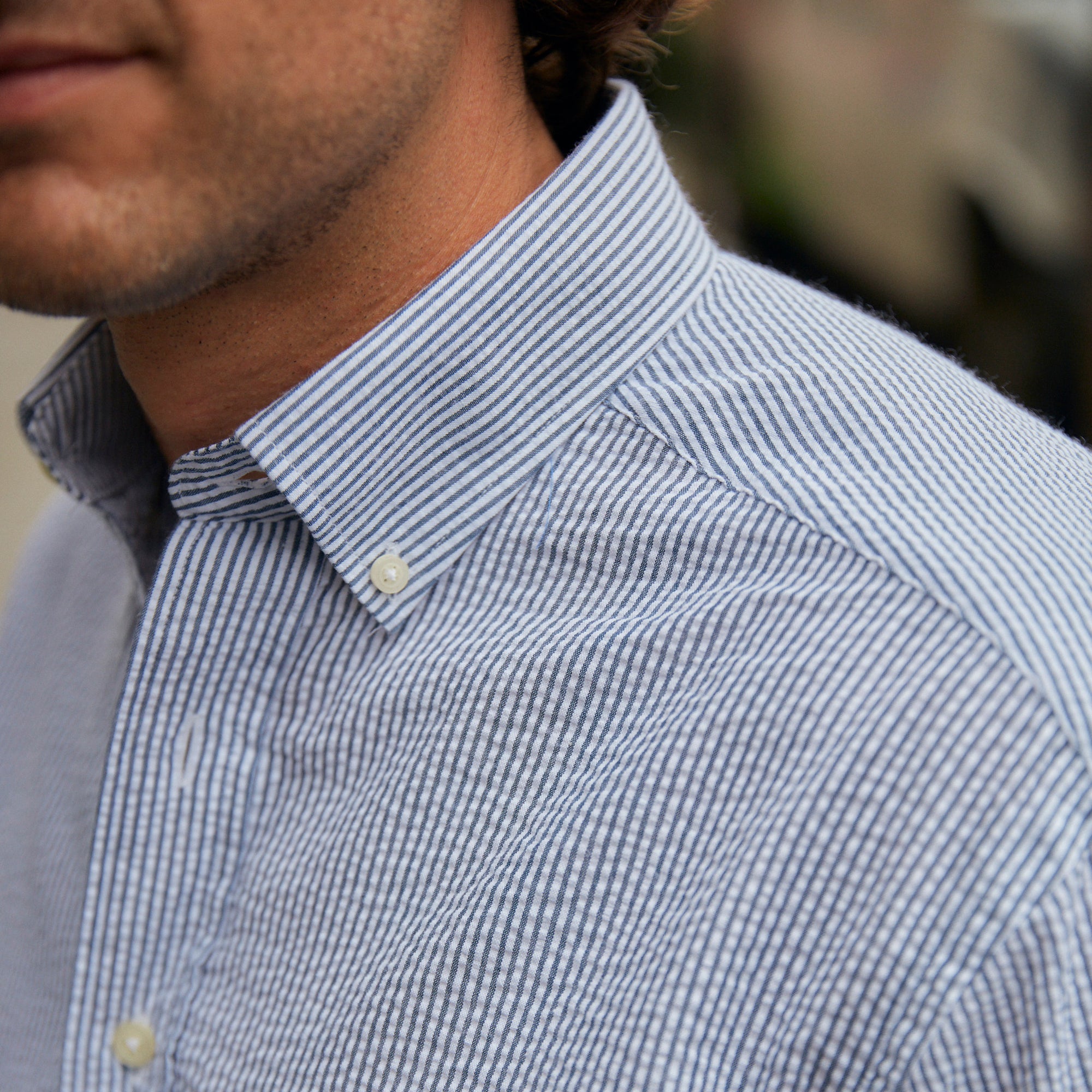 Seersucker all year long in a classic navy & white seersucker shirt. Subtle, lightweight, and a texture they begs a second look.  100% Cotton Seersucker • Button Down Collar • Short Sleeve • Chest Pocket • Machine Washable • Imported