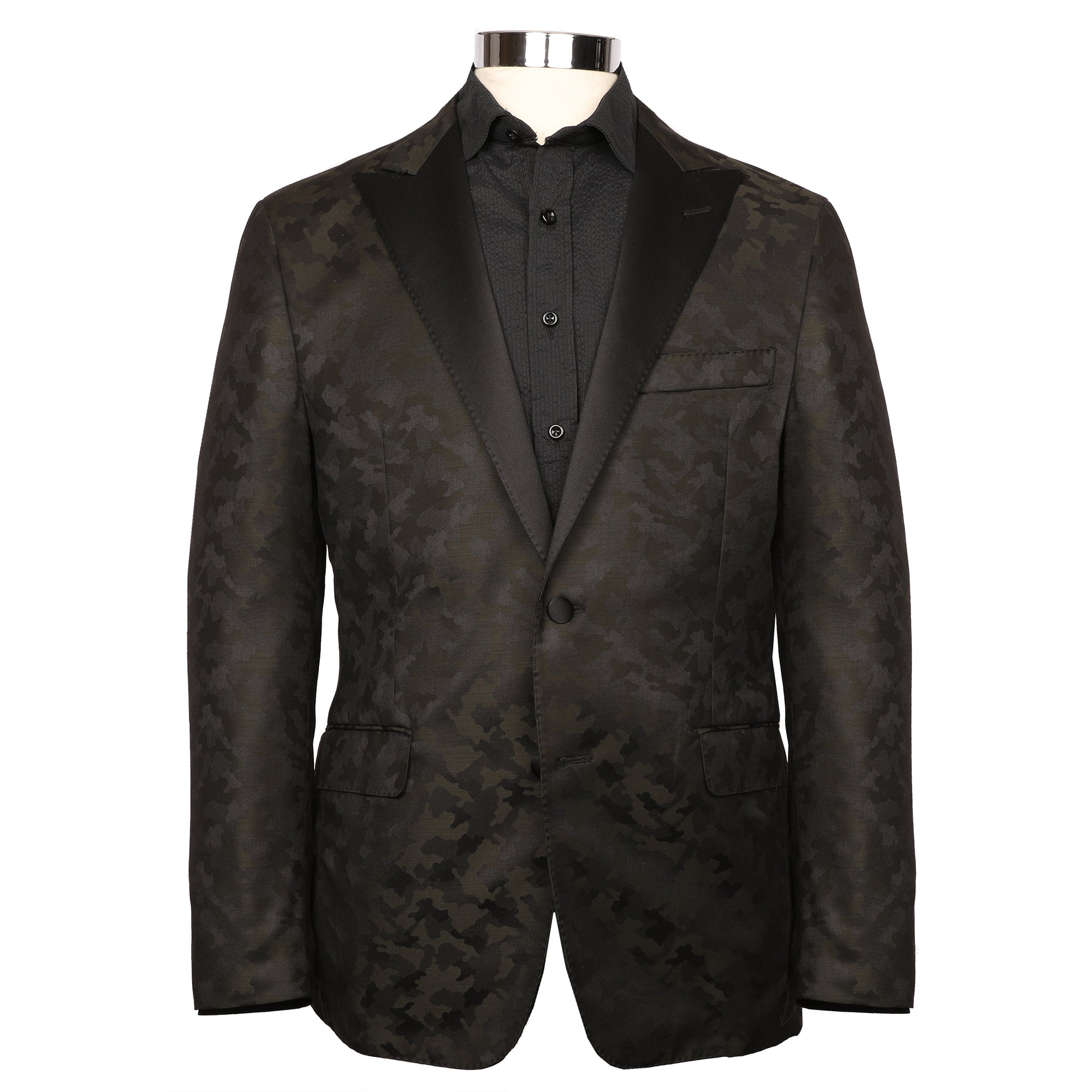 Let the Toulouse black/Olive Camo Dinner Jacket take you to your haute-couture occasions. A satin peak lapel, unique camo pattern, and smooth texture sets you apart from the pack.  Toulouse Modern Fit – Our Modern Fit.  A trimmer fitting jacket with a slightly higher arm hole.   60% Polyester / 20% Wool / 20% Viscose • Natural Shoulder • Two Buttons • Flap Pockets • 3/4 Lined for Maximum Cool • Side Vents • Satin Peak Lapel • Dry Clean • Made in USA