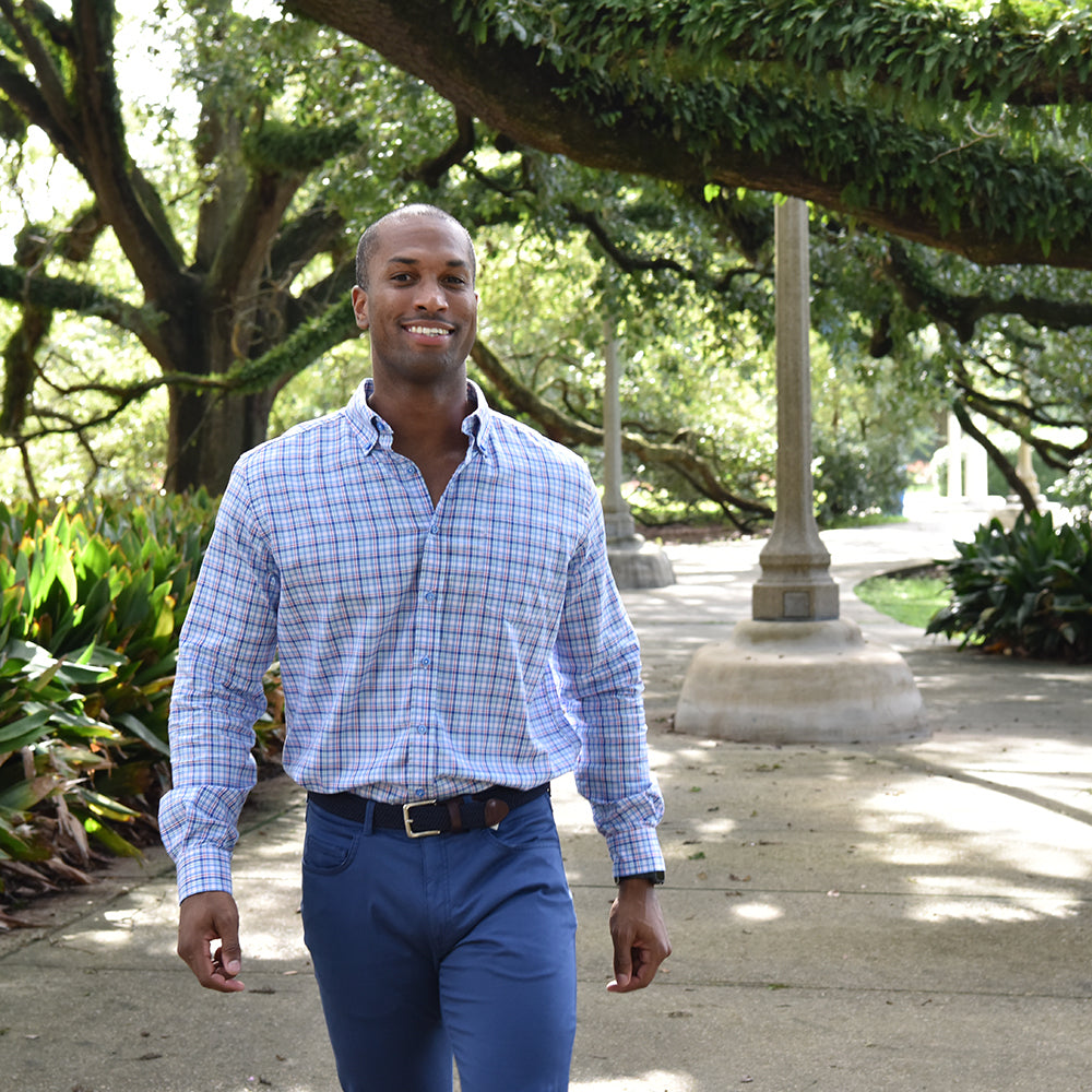 Another blue plaid shirt this is not. Stunning blue buttons highlight this complex yet simply plaid print shirt. Fine lines of red, green, and pink will make them take a closer look. Complex yet smooth, like a sip of Pappy&#39;s.  100% Cotton • Button Down Collar • Long Sleeve • Chest Pocket • Machine Washable • Made in Italy