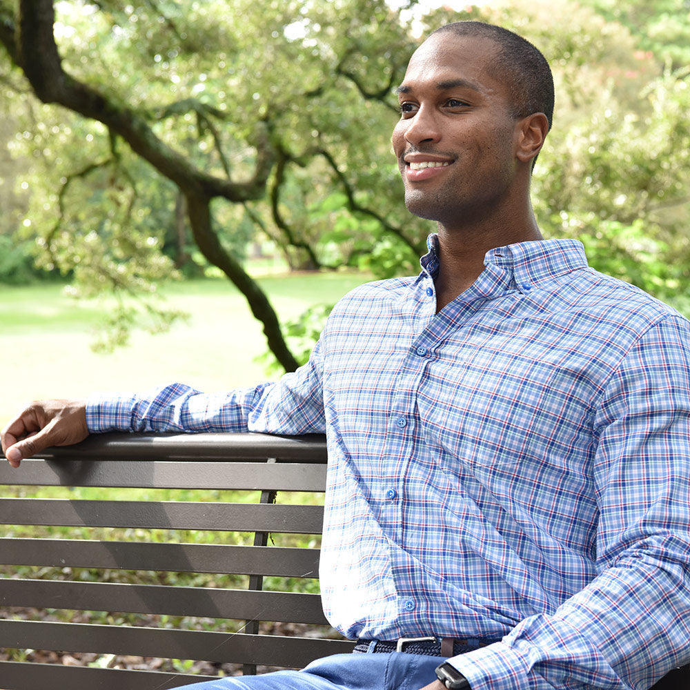 Another blue plaid shirt this is not. Stunning blue buttons highlight this complex yet simply plaid print shirt. Fine lines of red, green, and pink will make them take a closer look. Complex yet smooth, like a sip of Pappy&#39;s.  100% Cotton • Button Down Collar • Long Sleeve • Chest Pocket • Machine Washable • Made in Italy