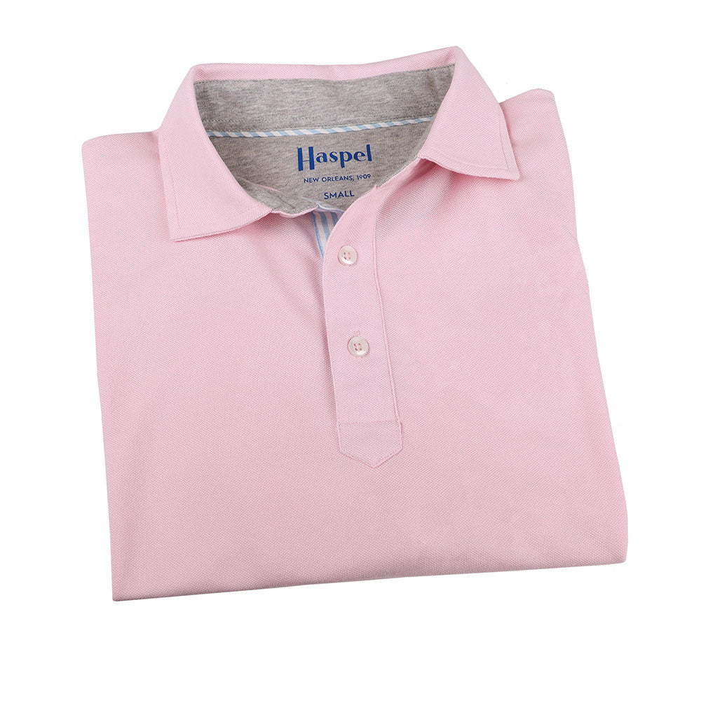 The softest pique polo to ever drape your statuesque torso. Enjoy that future perma-grin as you experience the touch and feel of a shirt that&#39;s simple in nature but exudes the quality of a Haspel man.  Our Signature Seersucker Piping and Placket • 3 Button Placket • Open Sleeve • Tagless/Printed Label for Ultimate Comfort • Stretch Comfort • 60% Cotton / 40% Polyester • Machine Washable • Return Policy