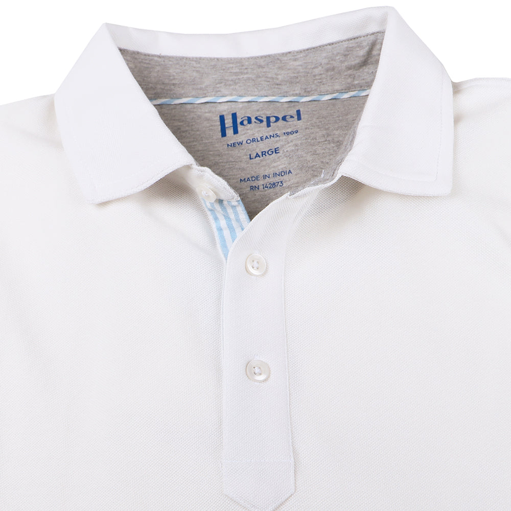 The softest pique polo to ever drape your statuesque torso. Enjoy that future perma-grin as you experience the touch and feel of a shirt that's simple in nature but exudes the quality of a Haspel man.  Our Signature Seersucker Piping and Placket • 3 Button Placket • Open Sleeve • Tagless/Printed Label for Ultimate Comfort • Stretch Comfort • 60% Cotton / 40% Polyester • Machine Washable • Return Policy