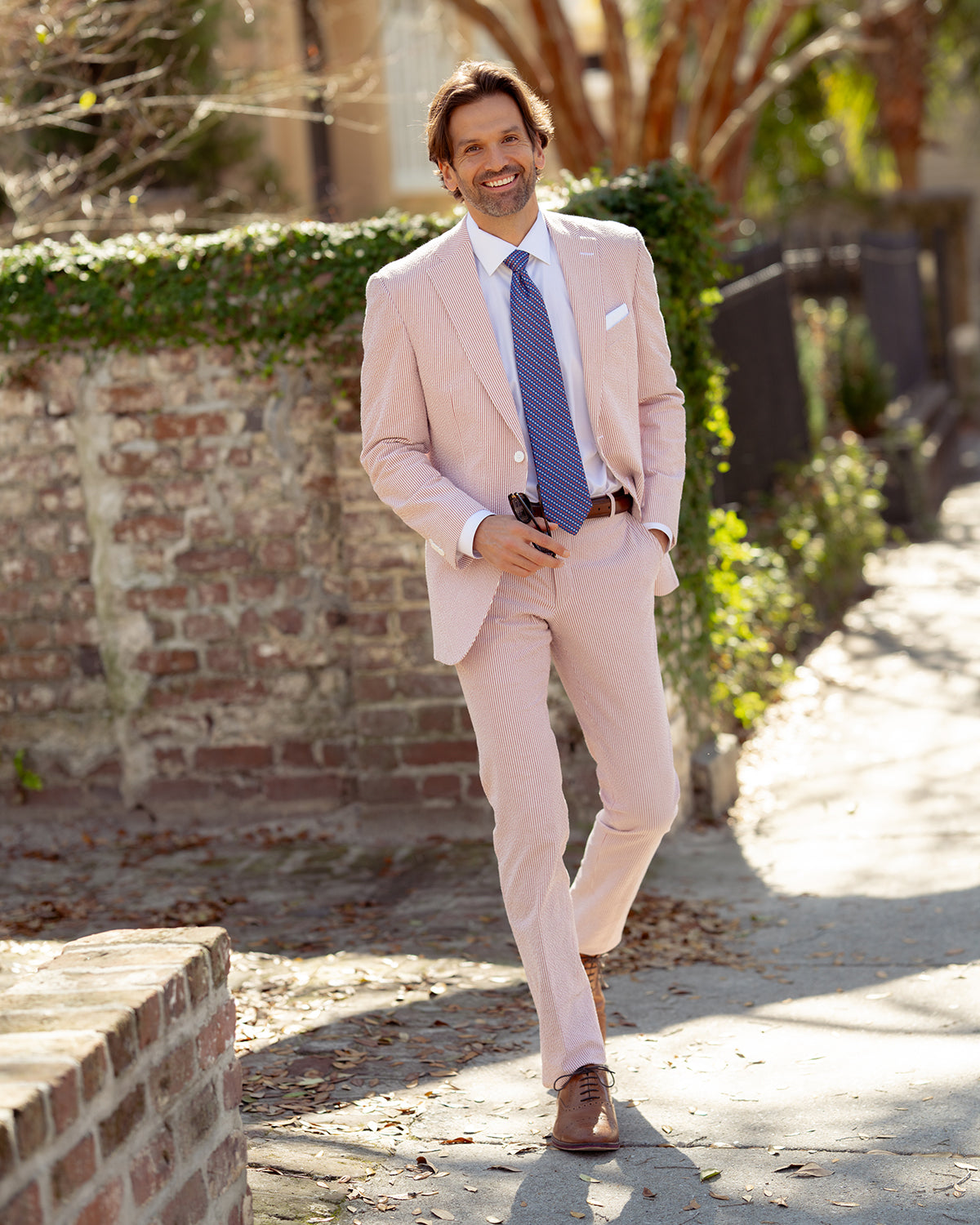 Hurricane? The cocktail or the storm? Locals get it and you'll get it too when you're chilling out in our red hurricane inspired seersucker. You're ready for anything life brings at you.  97% Cotton / 3% Lycra Haspel Exclusive Seersucker Stretch Fabric • Maximized Seersucker Pucker • Audubon Classic Fit • Natural Shoulder • Two Buttons • Flap Pockets • 3/4 Lined for Maximum Cool • Side Vents • Notch Lapel • Dry Clean • Imported