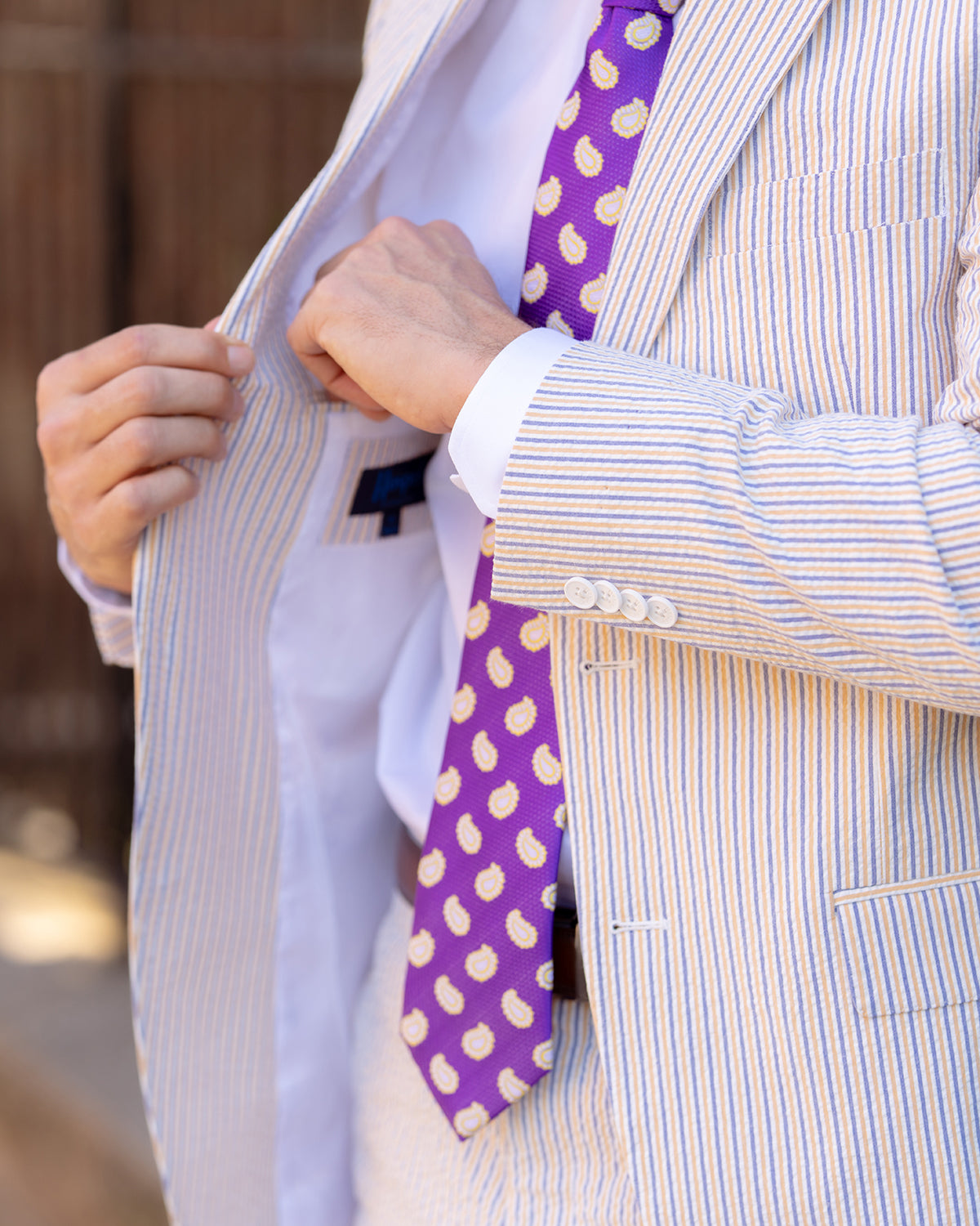 Show your purple & gold spirit in our Audubon Purple & Gold Seersucker Suit.  ** Pant waist is 6" smaller than the chest measurement. For example, if you order a 40R jacket, the pant size will be 34 **  100% Cotton Haspel Exclusive Seersucker • Maximized Seersucker Pucker • Audubon Classic Fit • Natural Shoulder • Two Buttons • Flap Pockets • 3/4 Lined for Maximum Cool • Side Vents • Notch Lapel • Dry Clean • Imported