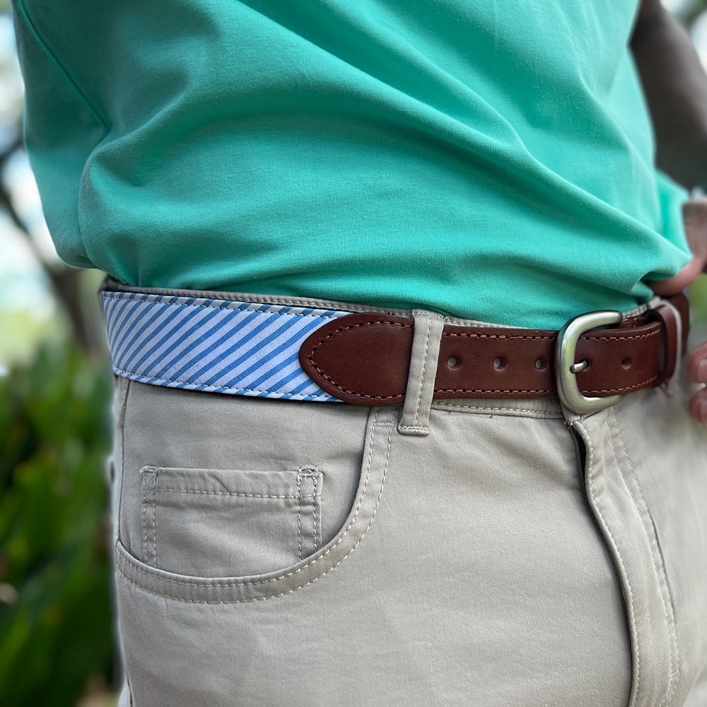 Our Haspel x T.B. Phelps collaboration belt is a stylish addition to any summer wardrobe, features you guessed it, seersucker stripes. Perfect for your summer trip! The seersucker is backed on sturdy nylon webbing, finished with a sturdy briar tab set and nickel finish buckle.