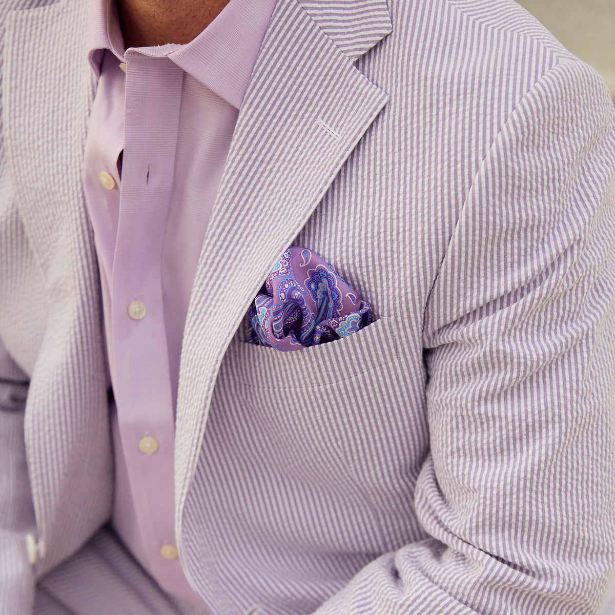 Turn heads in this exquisite Purple Haze Seersucker Stretch Sport Coat! Sleek and stylish, this classic is sure to cause a stir at your next event. With a unique purple hue and a comfortable stretch, this sport coat is perfect for adding a bold touch of sophistication to any look. Get your &quot;haze&quot; on and start feeling like a ten in this one-of-a-kind!