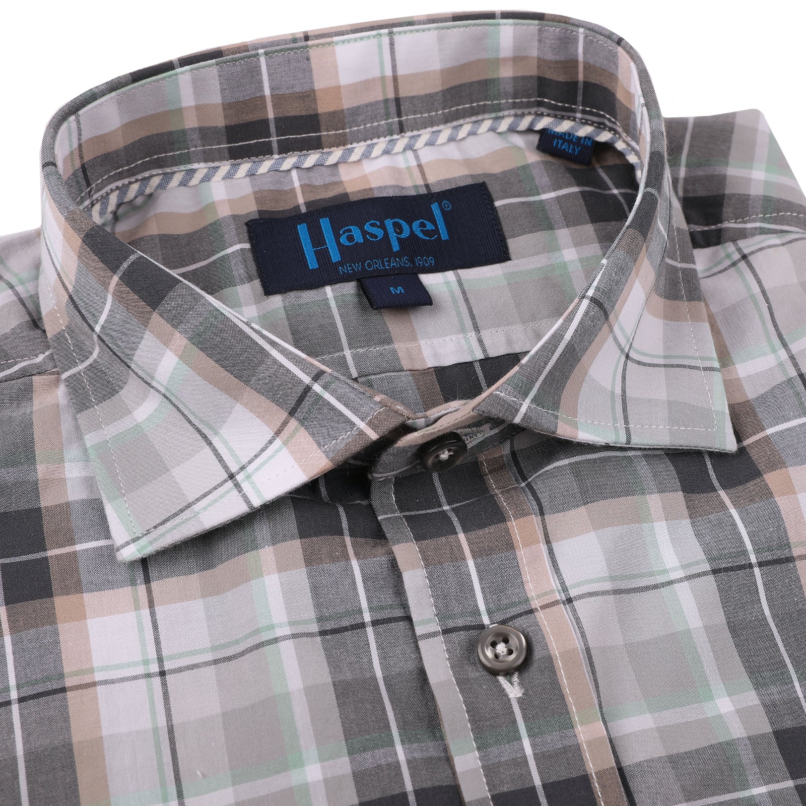 The Audubon Gray, Tan & Green Plaid shirt adds a classic touch to any wardrobe. Crafted from lightweight cotton, this plaid shirt is comfortable and breathable. The stylishly designed steely grey buttons give a modern edge to the traditional grey and tan pattern.  100% Cotton • Spread Collar • Long Sleeve • Chest Pocket • Machine Washable • Made in Italy • Return Policy