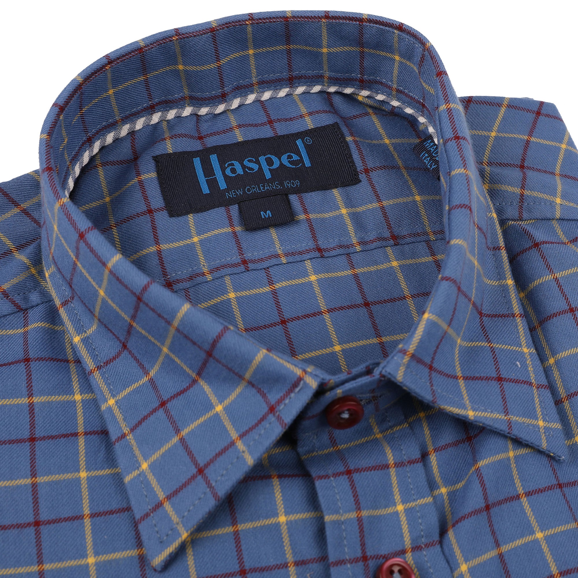 Our Treme Blue with Burgundy & Yellow Brushed Check is a stylish option for fall. The brushed check pattern mixes the cool blue hue with warm burgundy and yellow tones, creating a look that is both sophisticated and modern.  100% Cotton • Hidden Button Collar • Long Sleeve • Chest Pocket • Machine Washable • Made in Italy • Return Policy