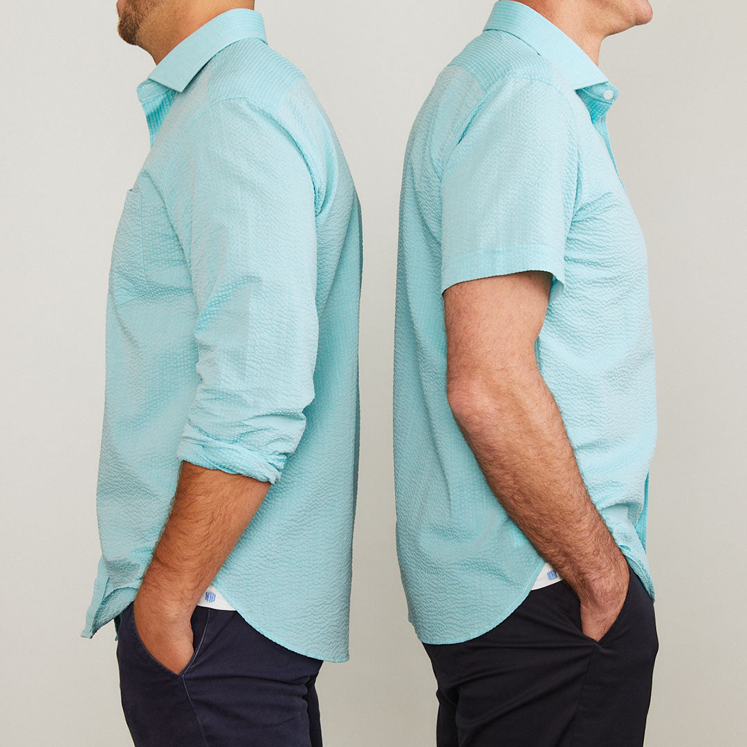A solid look for a solid guy. The light teal hues of the ocean are calling you in this shirt. Seersucker, lightweight, and supremely cool. Available in short or long sleeve.  100% Cotton Seersucker  •  Spread Collar  •  Short Sleeve  •  Contrast Buttons  •  Chest Pocket  •  Machine Washable  •  Made in Italy