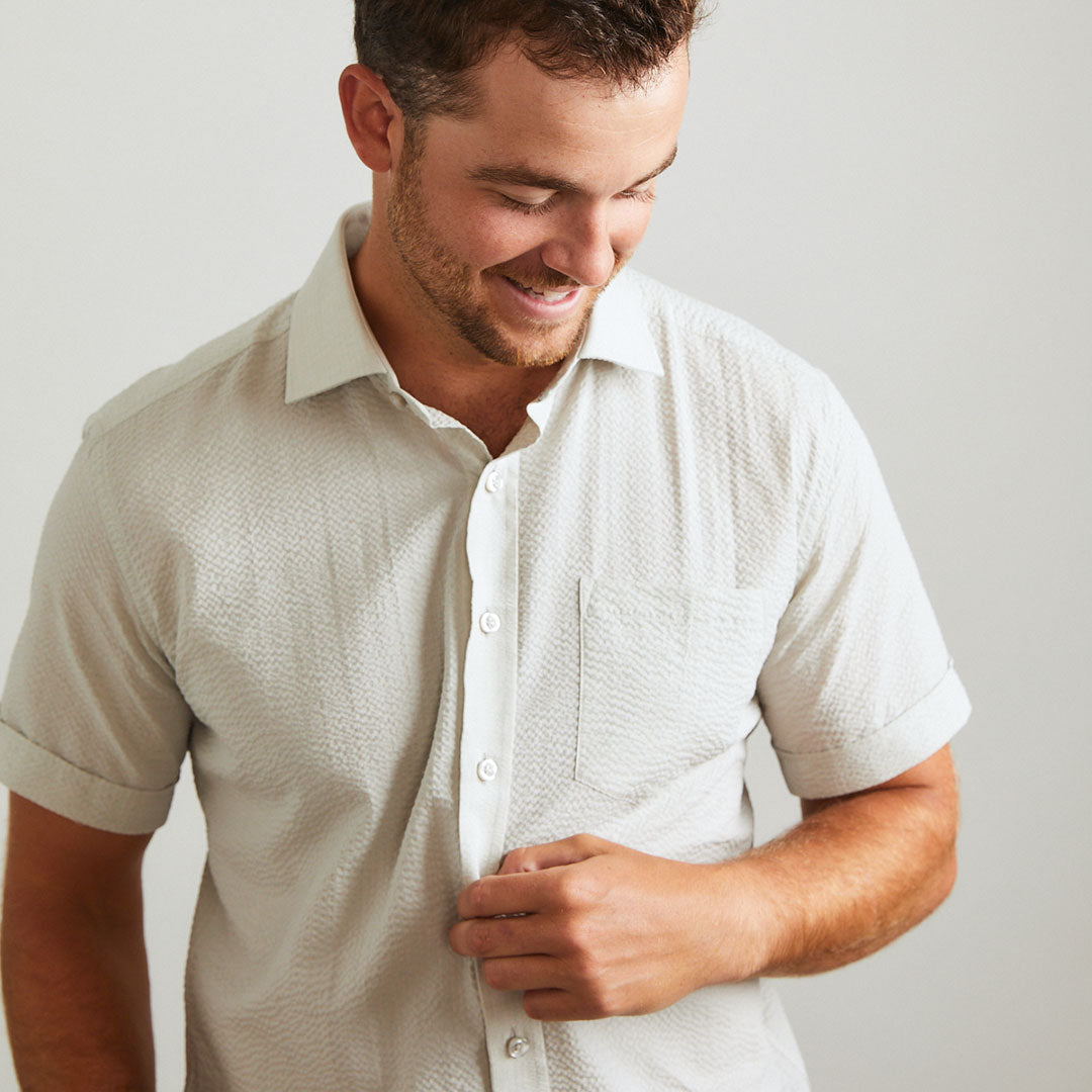 A solid look for a solid guy. The classic look of light grey on a short sleeve seersucker beauty. Seersucker, lightweight, and supremely cool. Available in short or long sleeve.  100% Cotton Seersucker  •  Spread Collar  •  Short Sleeve  •  Chest Pocket  •  Machine Washable  •  Made in Italy
