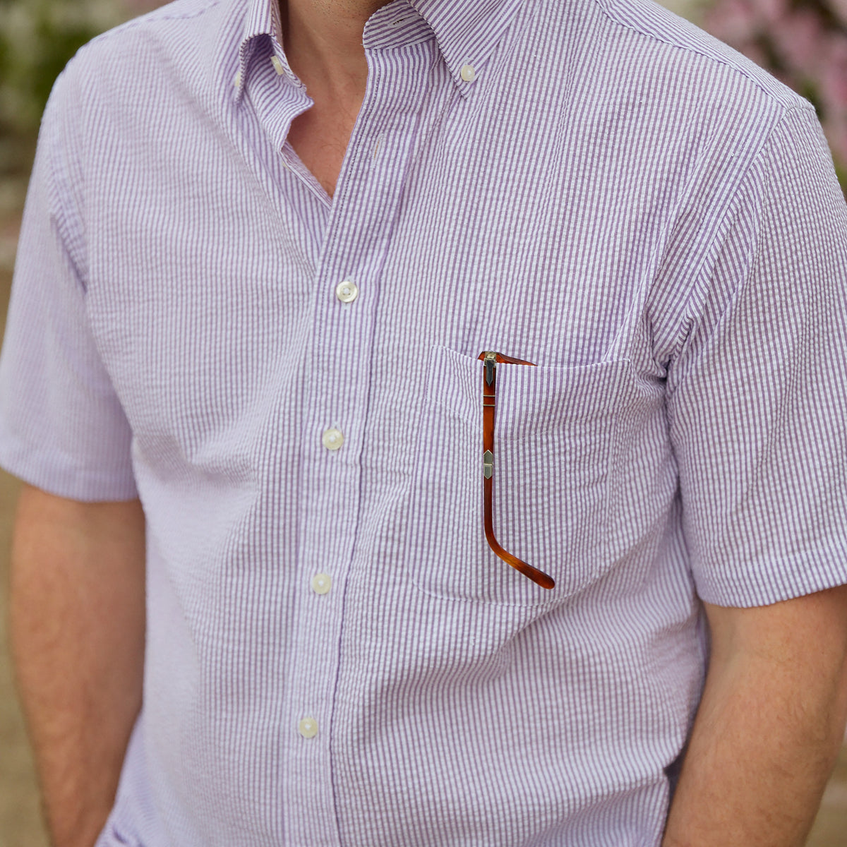 Seersucker all year long in a lavender purple seersucker shirt. Subtle, lightweight, and a texture they begs a second look.  100% Cotton Seersucker • Button Down Collar • Short Sleeve • Chest Pocket • Machine Washable • Made in Italy 