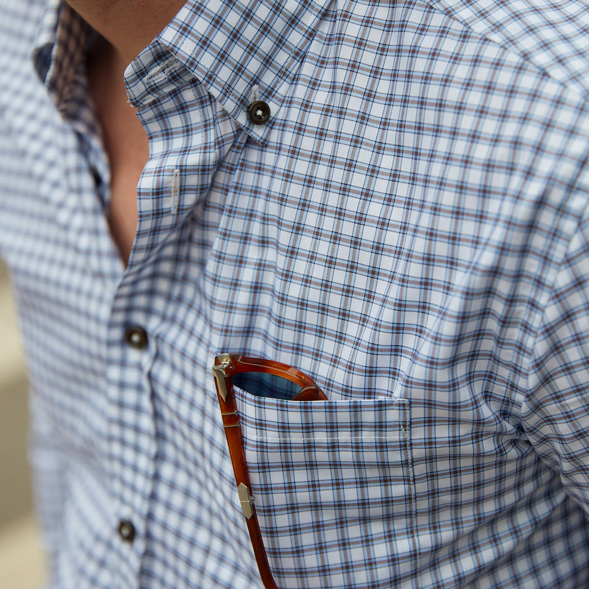 Enjoy the luxury of 100% cotton, Italian made quality, and eye-catching blue and brown graph check.  100% Cotton • Button Down Collar • Long Sleeve • Contrast Buttons • Chest Pocket • Machine Washable • Made in Italy