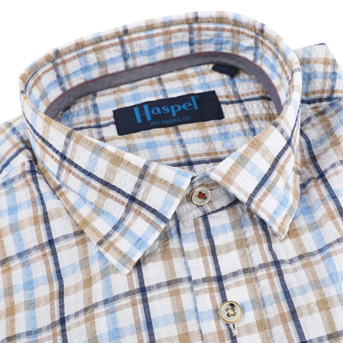 Look oh-so-cool and stay feeling hot with this Naples Blue &amp; Tan Long Sleeve Check Seersucker Shirt. Crafted from lightweight seersucker fabric that&#39;s craft fully dyed for a unique look, you&#39;ll be ready for warm weather, whatever the season. Pucker up for a style that&#39;ll have onlookers in awe.