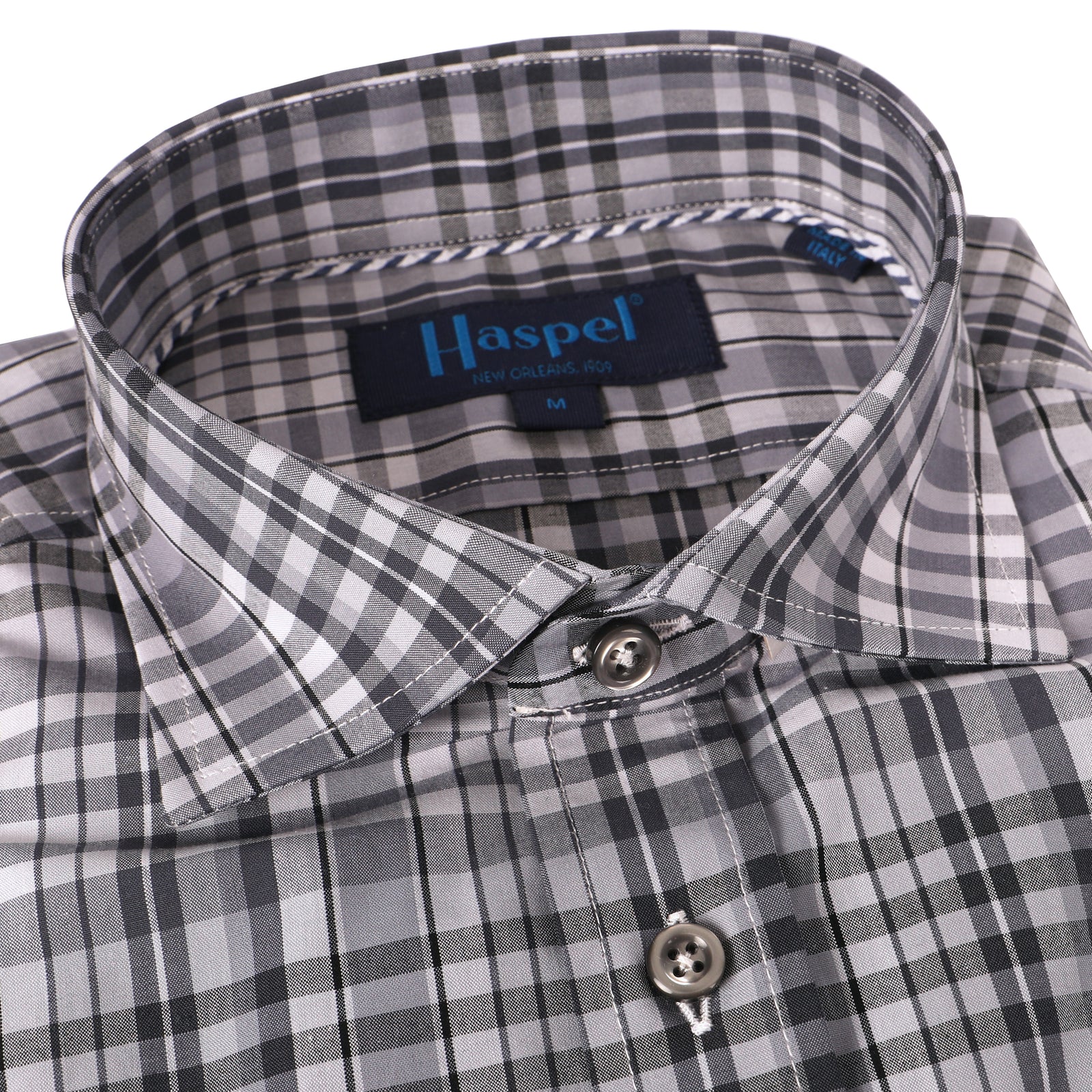 Charcoal buttons are the olive in the martini on this perfectly plaid grey beauty.  100% Cotton Seersucker  •  Spread Collar  •  Long Sleeve  •  Chest Pocket  •  Machine Washable  •  Made in Italy