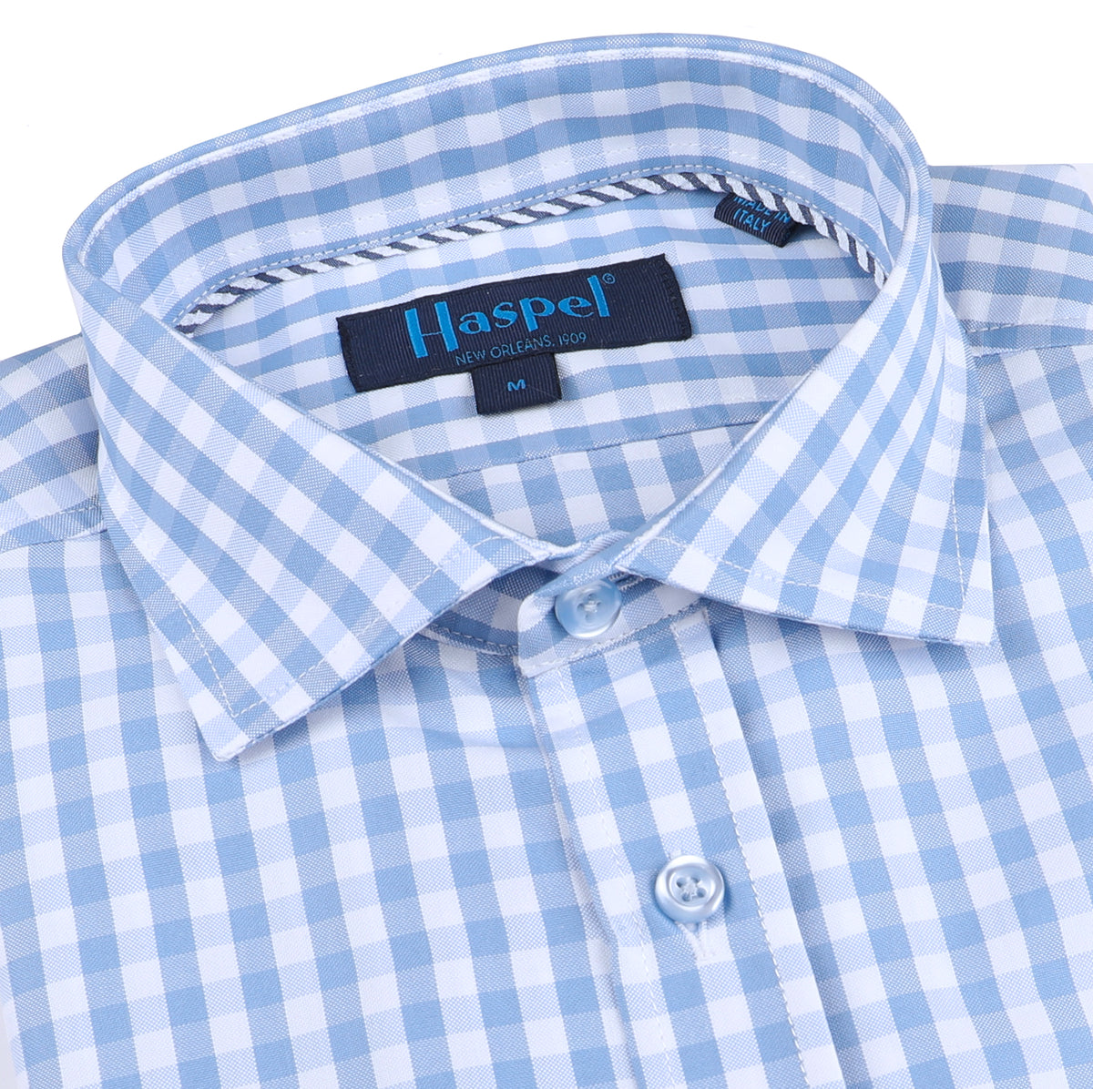 Nothing quite like a man in a blue gingham check. Calming tones and a that lightweight feel.  100% Cotton  •  Spread Collar  •  Long Sleeve  •  Chest Pocket  •  Machine Washable  •  Made in Italy