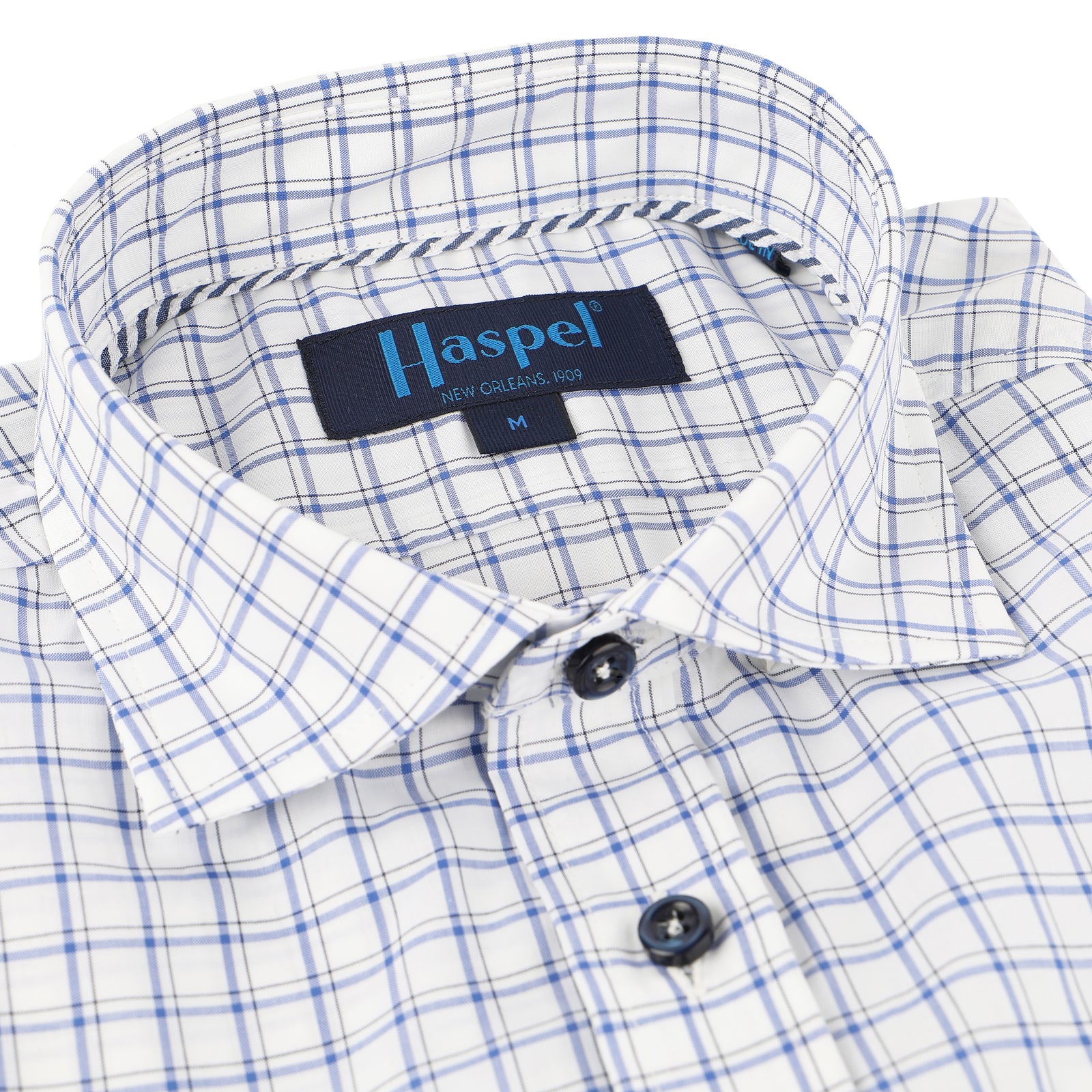 Enjoy the luxury of 100% cotton, Italian made quality, and light blue double check.  100% Cotton • Spread Collar • Long Sleeve • Chest Pocket • Machine Washable • Made in Italy 