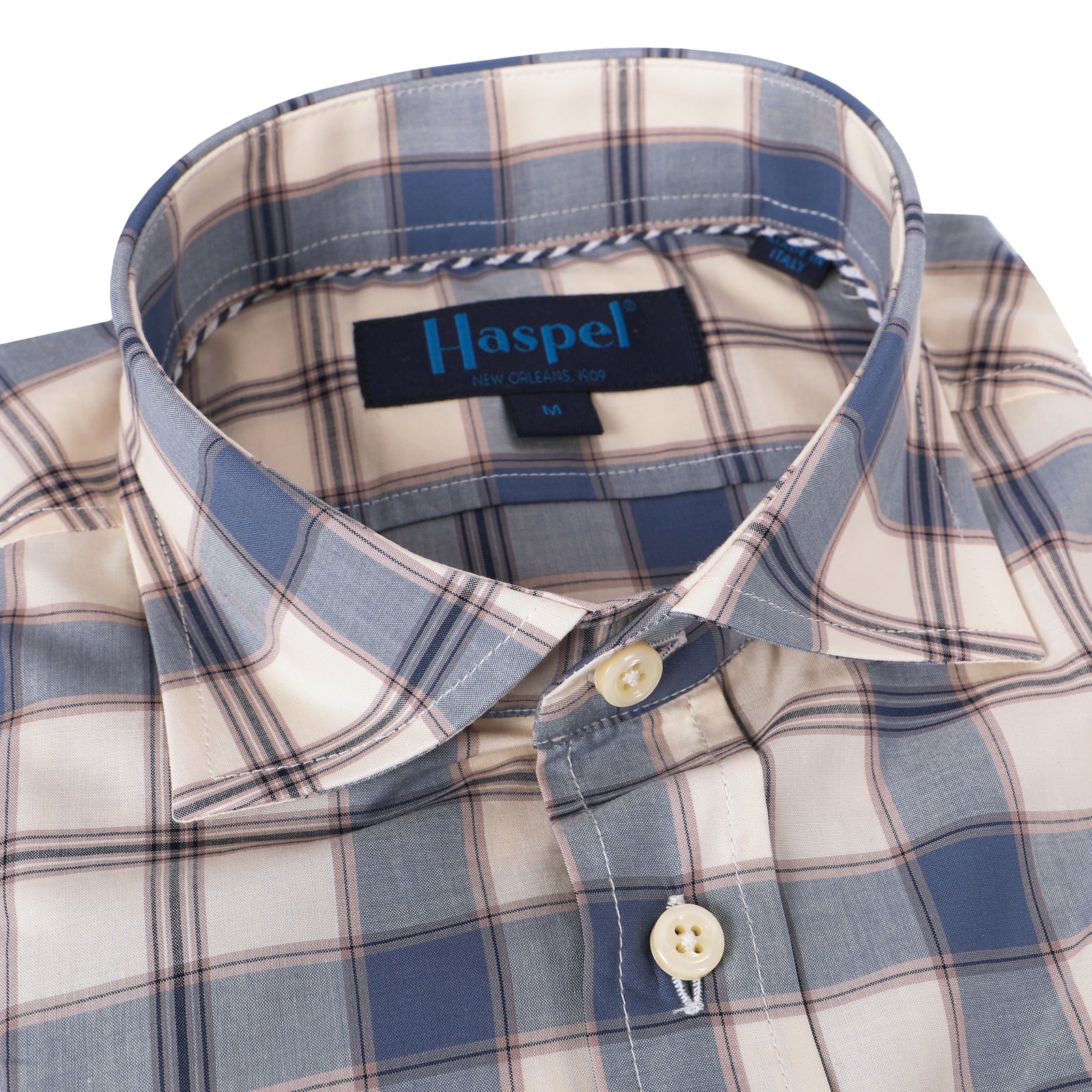 We know you love blue plaid, so we've shaken it up with a little Ecru background. A relaxed, lightweight look for the office, dinner, and any good times in between.  100% Cotton Seersucker  •  Spread Collar  •  Long Sleeve  •  Chest Pocket  •  Machine Washable  •  Made in Italy