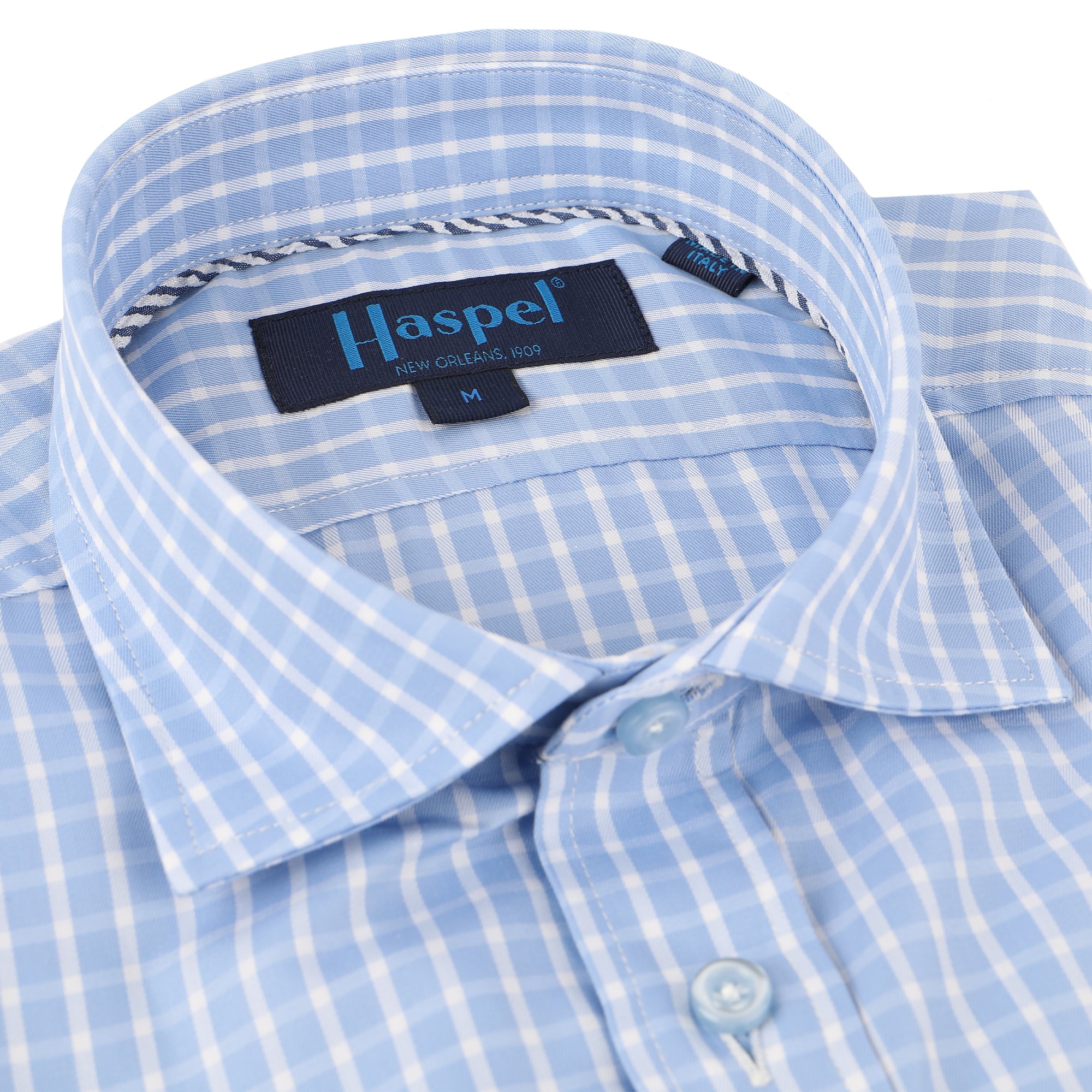 Enjoy the luxury of 100% cotton, Italian made quality, and a subdued light blue and white graph check.  100% Cotton • Spread Collar • Long Sleeve • Chest Pocket • Machine Washable • Made in Italy