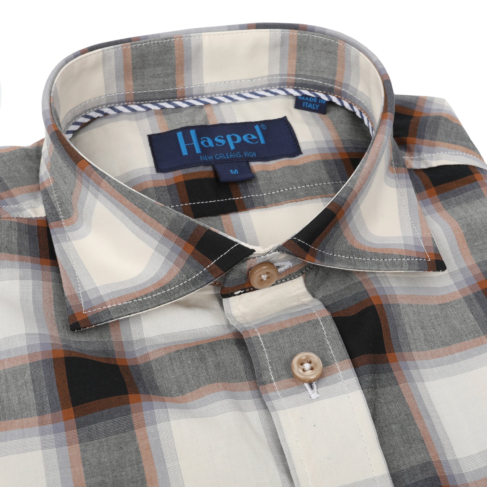 Who says you can't wear black and brown? Expertly paired, any colors can work. A little Haspel blue to brighten up this look, ready for anything.  100% Cotton Seersucker  •  Spread Collar  •  Long Sleeve  •  Chest Pocket  •  Machine Washable  •  Made in Italy