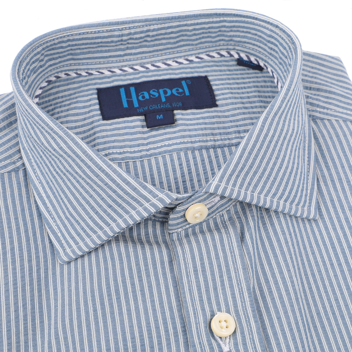 Classic white and navy subtle stripes and a texture that can't be beat. Beat the heat in seersucker.  100% Cotton Seersucker • Spread Collar • Long Sleeve • Chest Pocket • Machine Washable • Made in Italy 