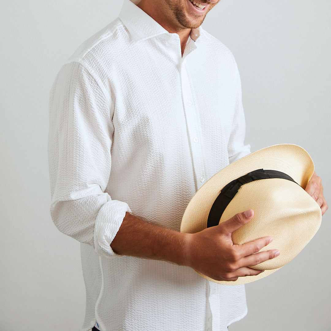 A solid look for a solid guy. THE white shirt you need this season. Seersucker, lightweight, and supremely cool. Available in short or long sleeve.  100% Cotton Seersucker  •  Spread Collar  •  Long Sleeve  •  Chest Pocket  •  Machine Washable  •  Made in Italy 